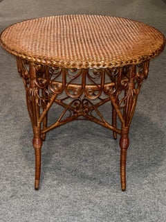 A Round Antique Victorian Elaborately Woven and Decorated Wicker Center Table