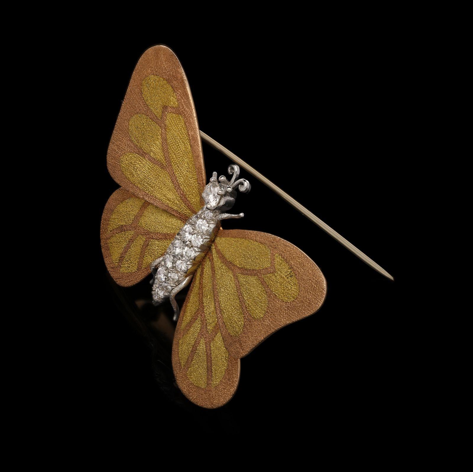 A beautiful and unusual diamond and gold butterfly brooch c.1960s, the body in white gold pavé set throughout with round brilliant diamonds, the head set with a single diamond and with short, curled antennae and the legs with a gently textured