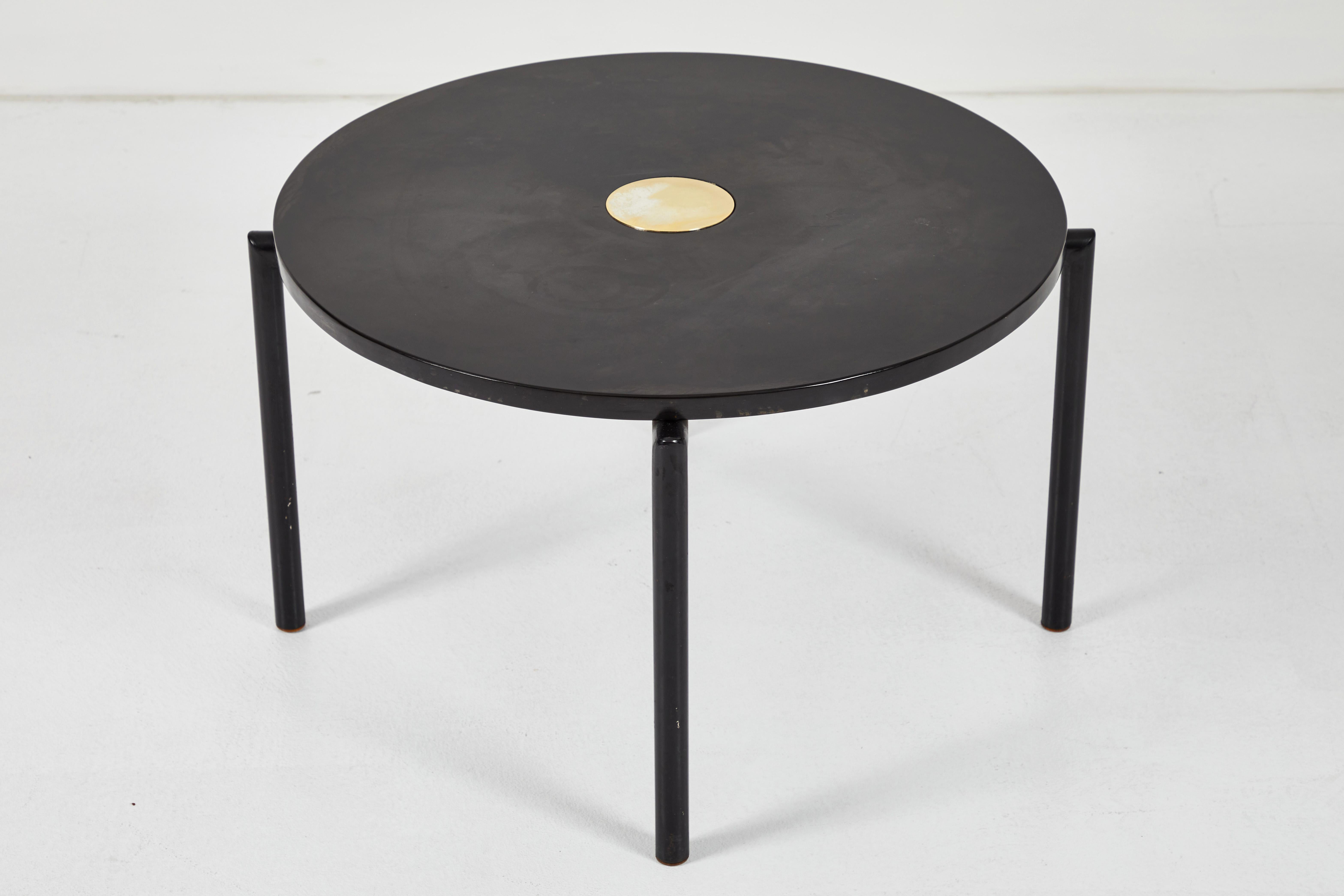 This striking round table by Billy Haines is a prime example of the quality of Haines' furniture. The table top is fabricated in stone and includes a round 4