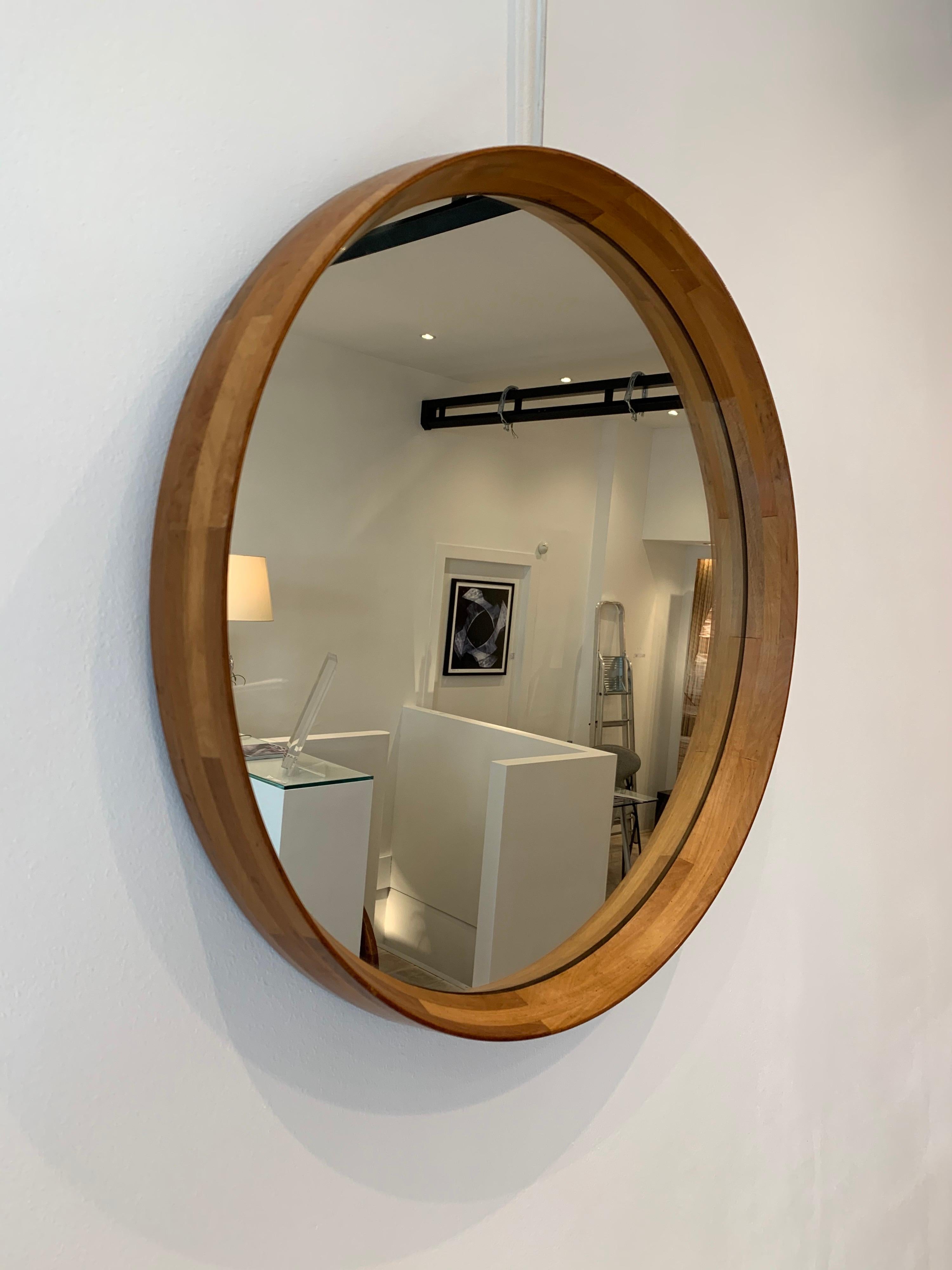 Nice Italian decorative round wood mirror.