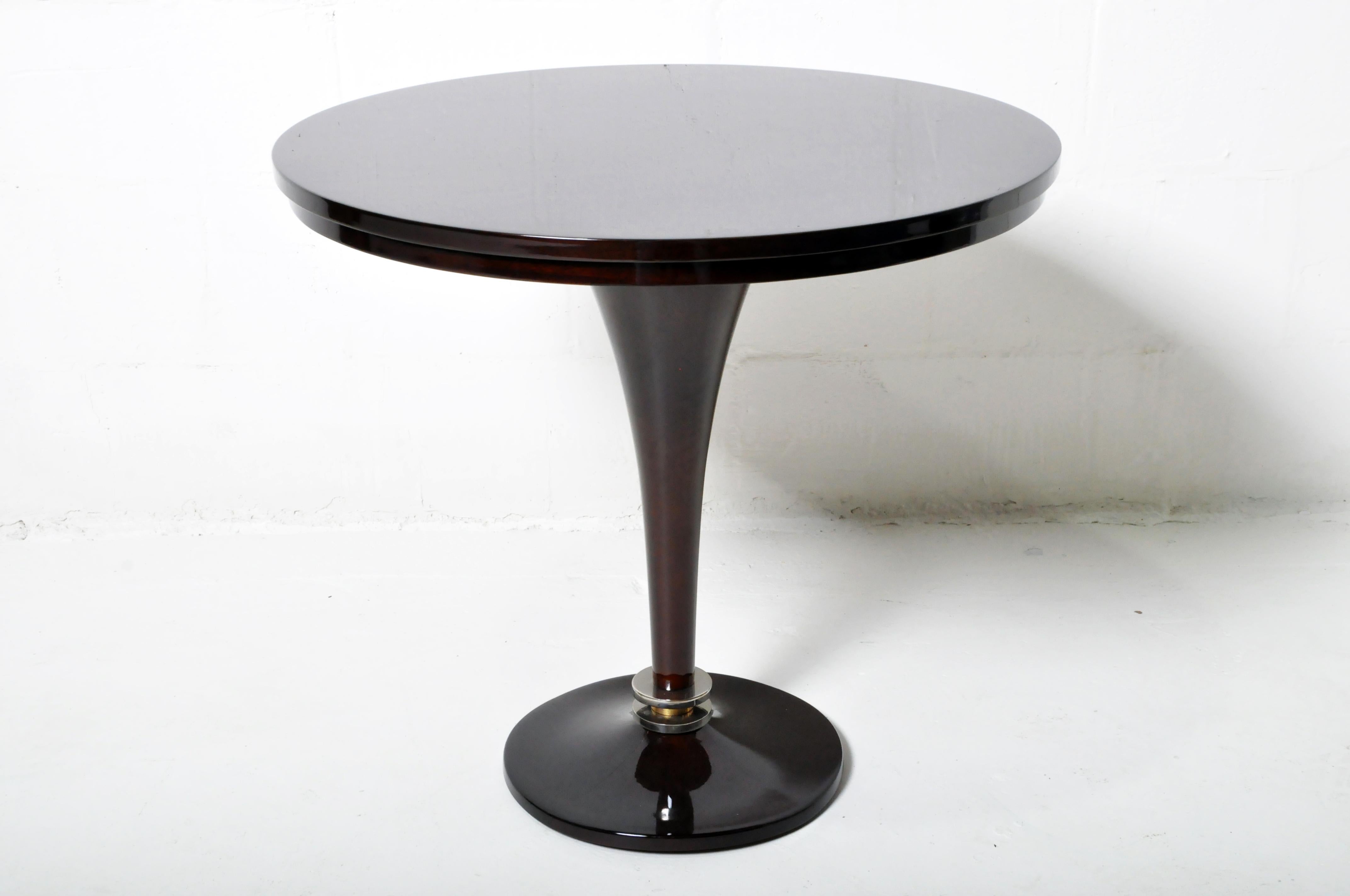 A dark lacquer-on-walnut veneer pedestal side table from a Hungarian atelier. The original design inspiration is French Art Deco. Many Hungarian Art Deco pieces are quite similar to French and Italian Art Deco designs. In fact, the Hungarians have
