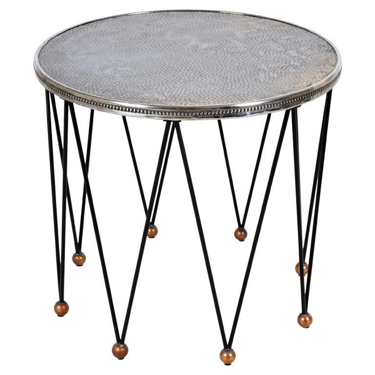 A Round Side Table with 8 Iron Legs And Embossed Metal Top For Sale at
