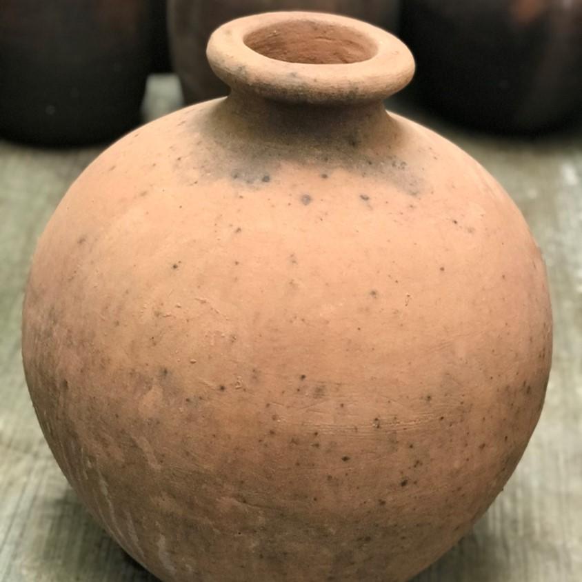 Sancho is a vintage terracotta vessel discovered in a potters studio in the region of Jalisco, Mexico. This vessel references a pottery style typical of Oaxacan region. This well rounded terracotta pieces has very elegant patina. This piece can used