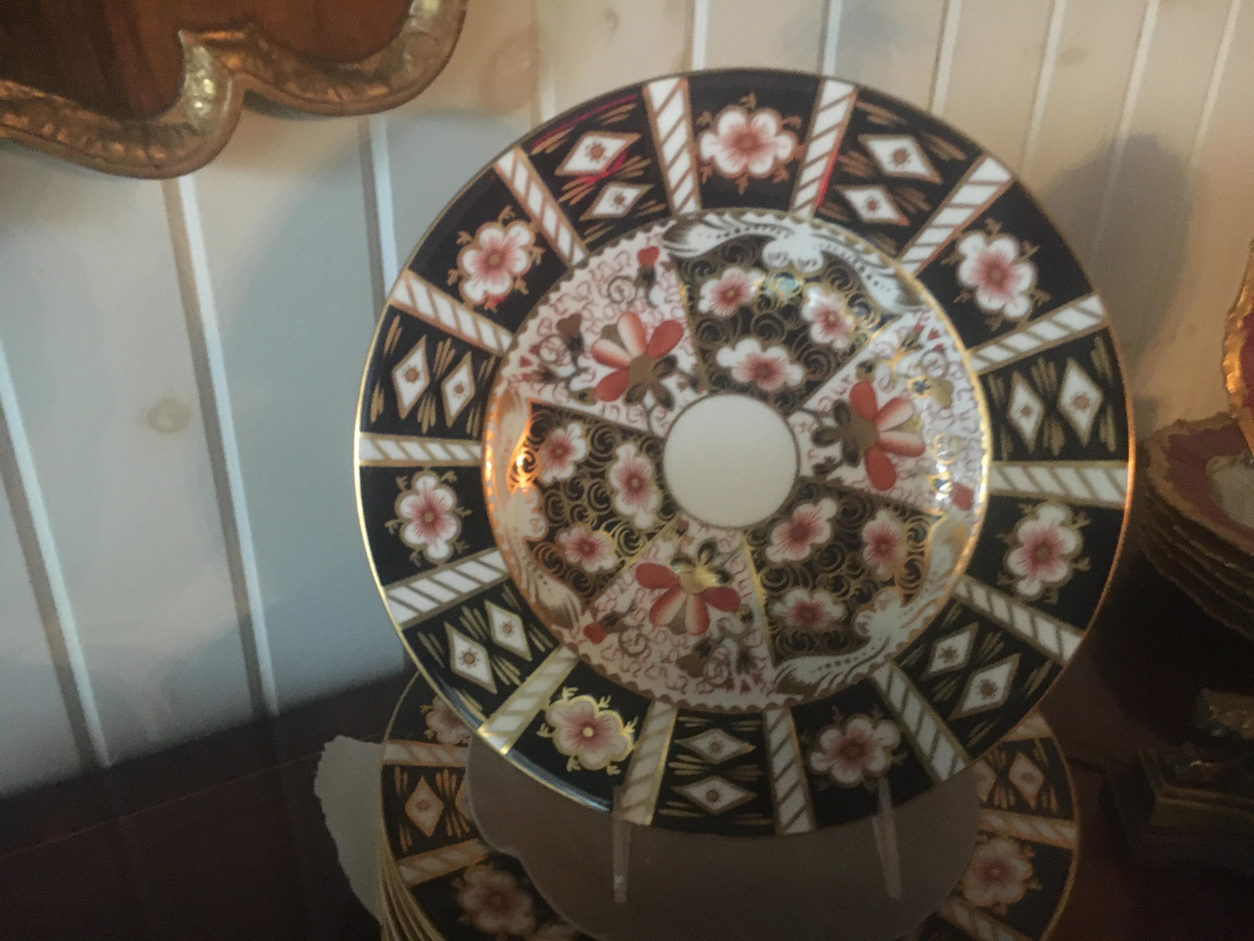 A Royal Crown Derby Partial dinner service in the traditional Imari pattern. Measures: Diameter of dinner plate 10.5