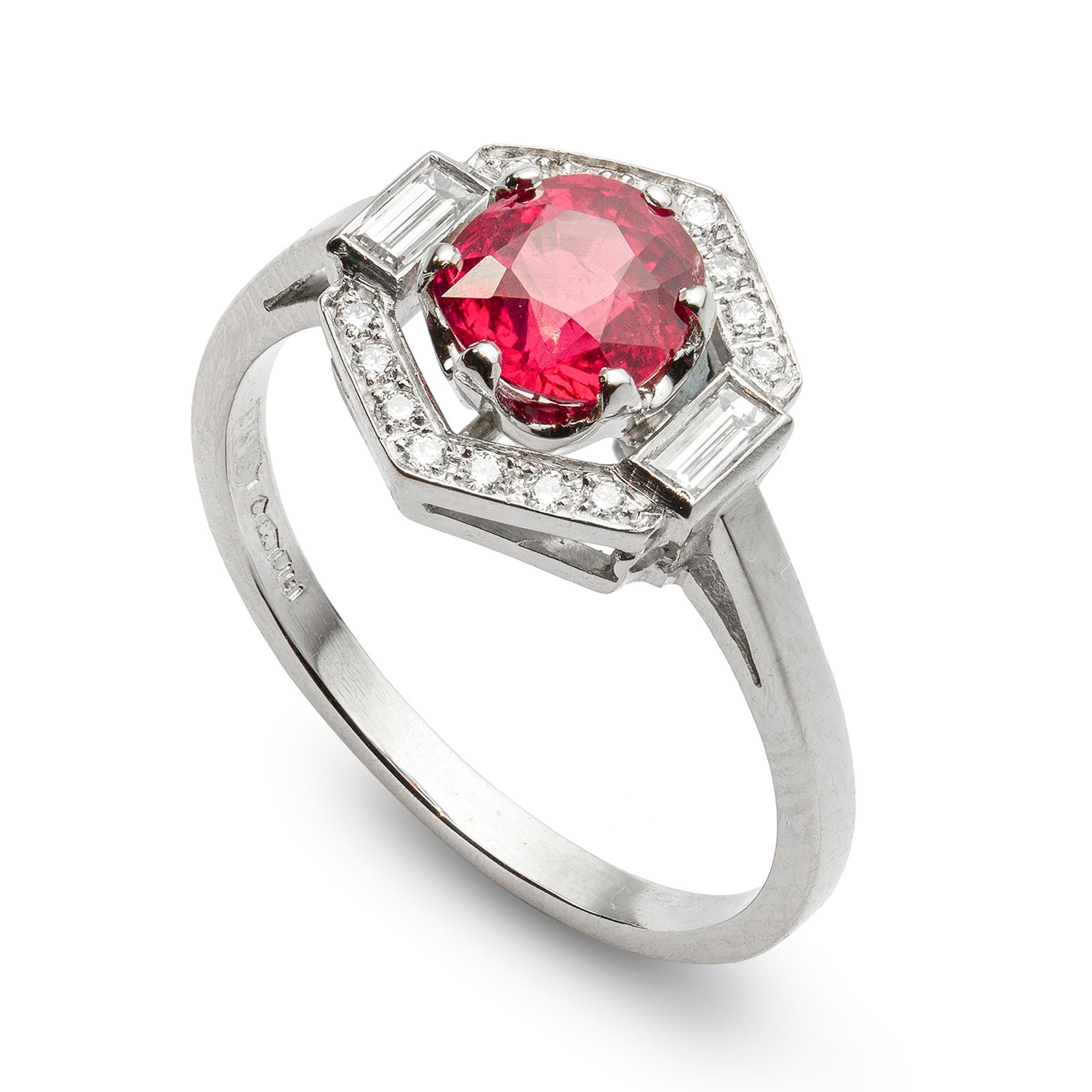 A ruby and diamond hexagonal cluster ring, the central round-cut ruby weighing 0.98 carats, six claw set to the centre of round brilliant- and baguette-cut diamond cluster surround, to a white mount with lift-up shoulders, hallmarked platinum London