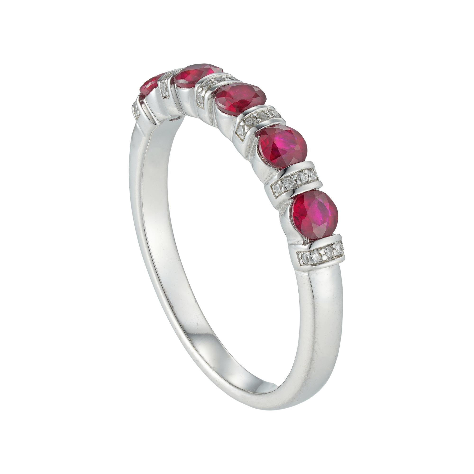 A ruby and diamond half eternity ring, consisting of five round brilliant-cut rubies weighing 0.68 carats in total, tension-set between six round brilliant-cut diamond-set sections, the diamonds weighing 0.06 carats in total, all mounted in white