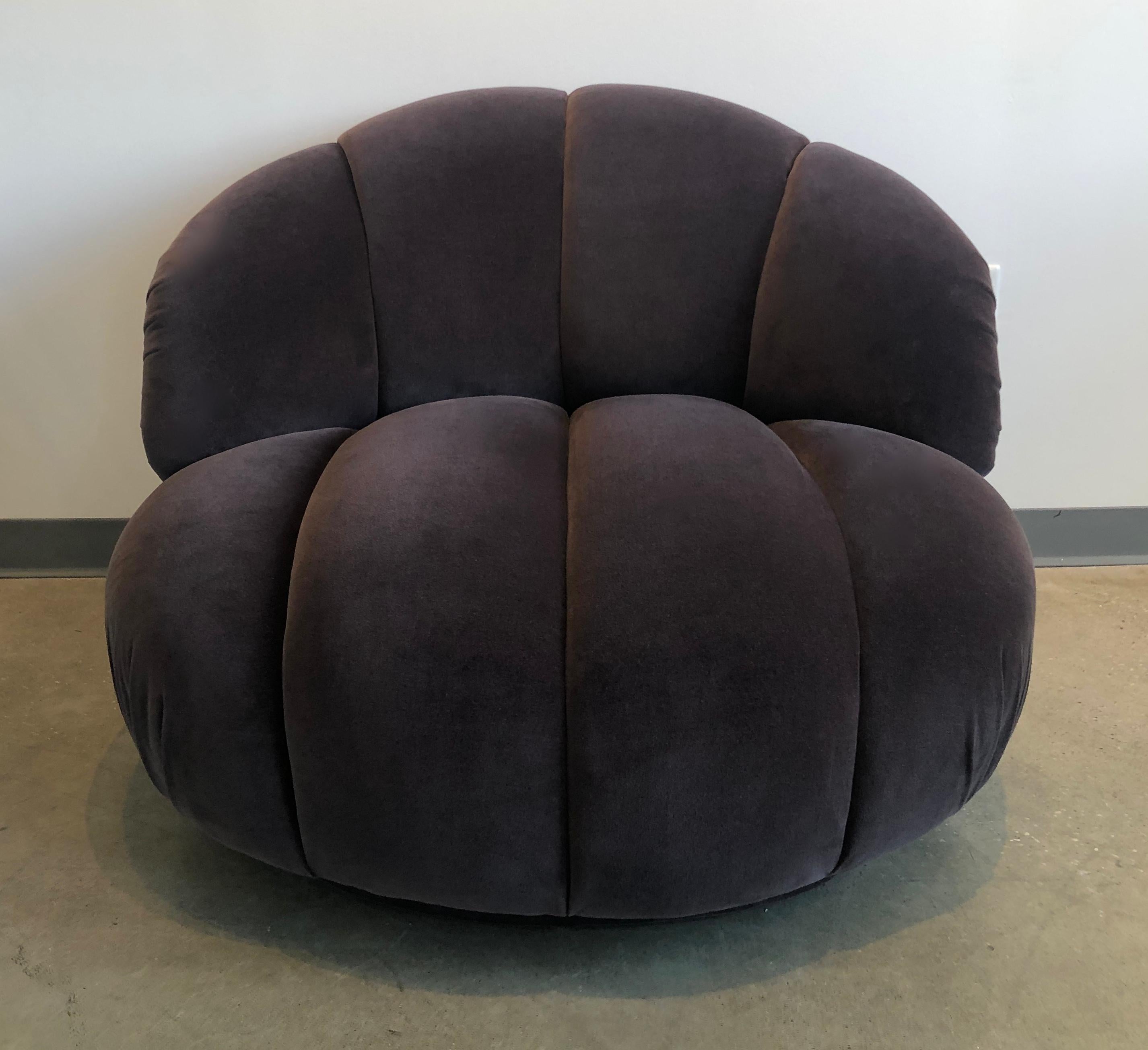 Offered is an A. Rudin channel back with a channeled seat newly upholstered in a very chic graphite gray / sable brown cotton velvet slipper / lounge chair. This gracious oversized slipper chair has four steel metal gliders that allows the chair to