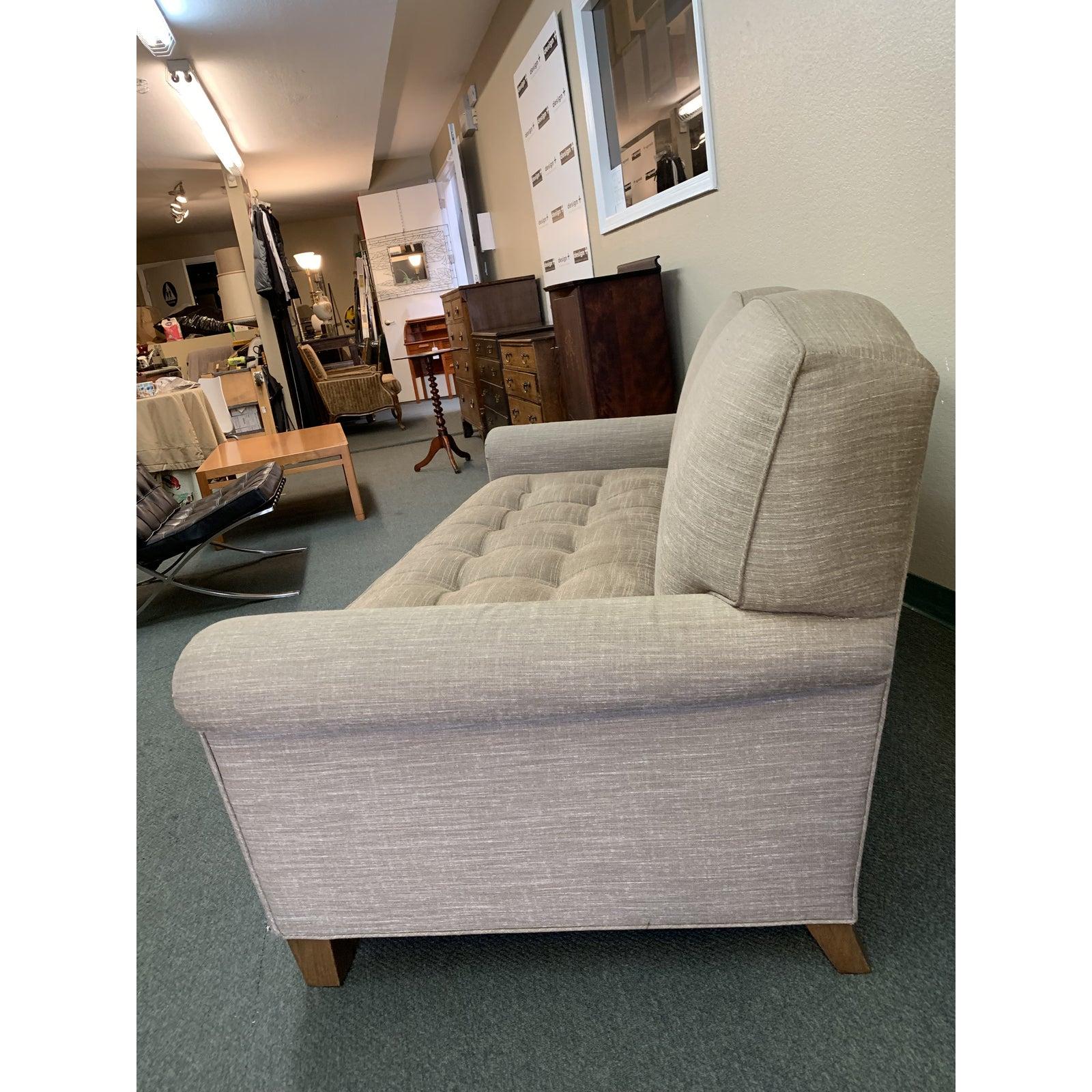 Design Plus Gallery presents a classic loveseat by A. Rudin. The softly curved back and rolled arms offer a casual elegance, a pair of textured fabrics offer a bit of surprise. Tufts in the down-wrapped bench cushion are buttonless. Tapered