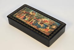 A Russian hand painted papier mâché box decorated with intricate scenes C1920
