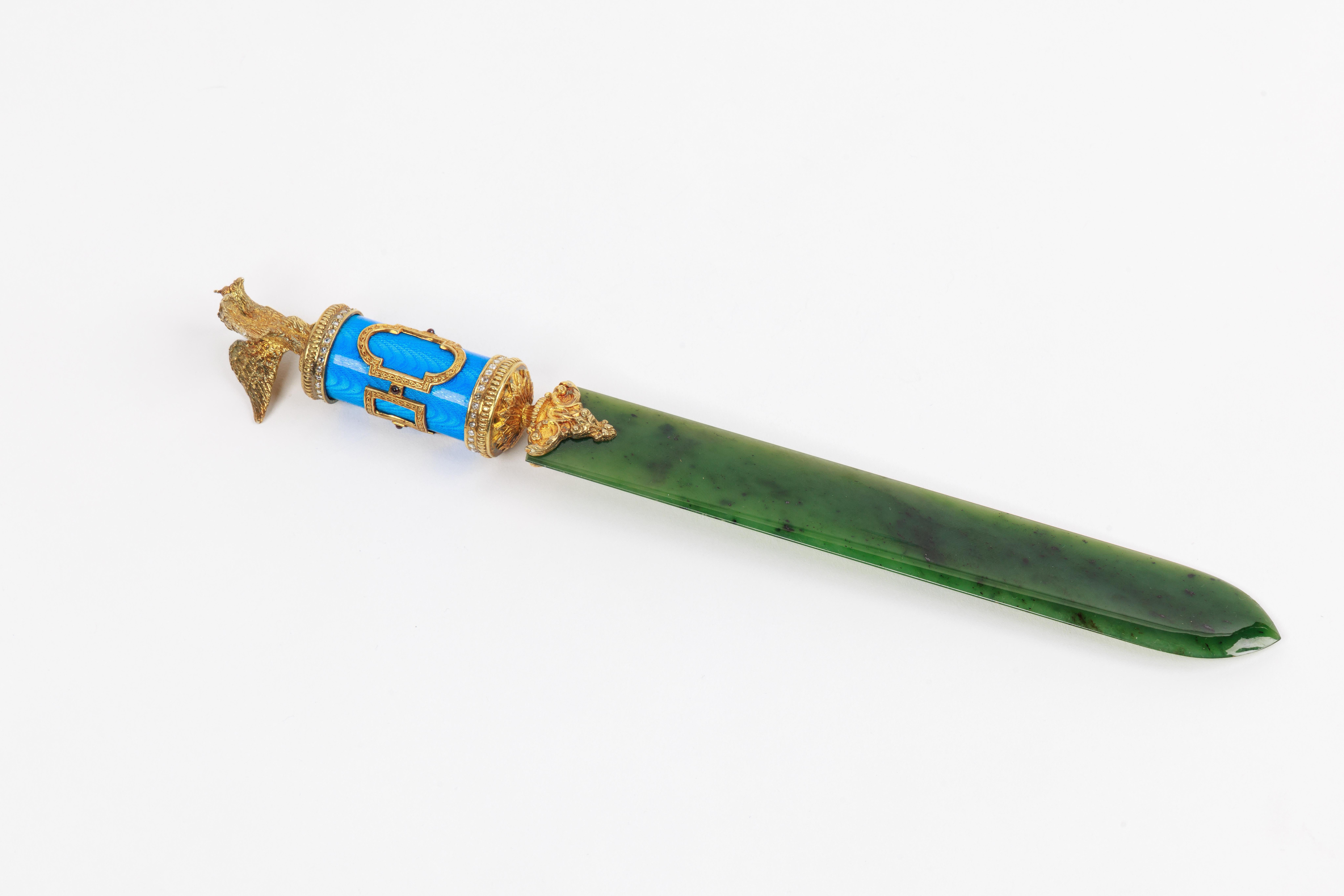 A Russian silver-gilt, diamonds, nephrite, and blue Guilloche enamel letter opener, with a Russian double eagle, in original fitted box.

Exquisite jewel like quality, in the Faberge style.

Measures 10