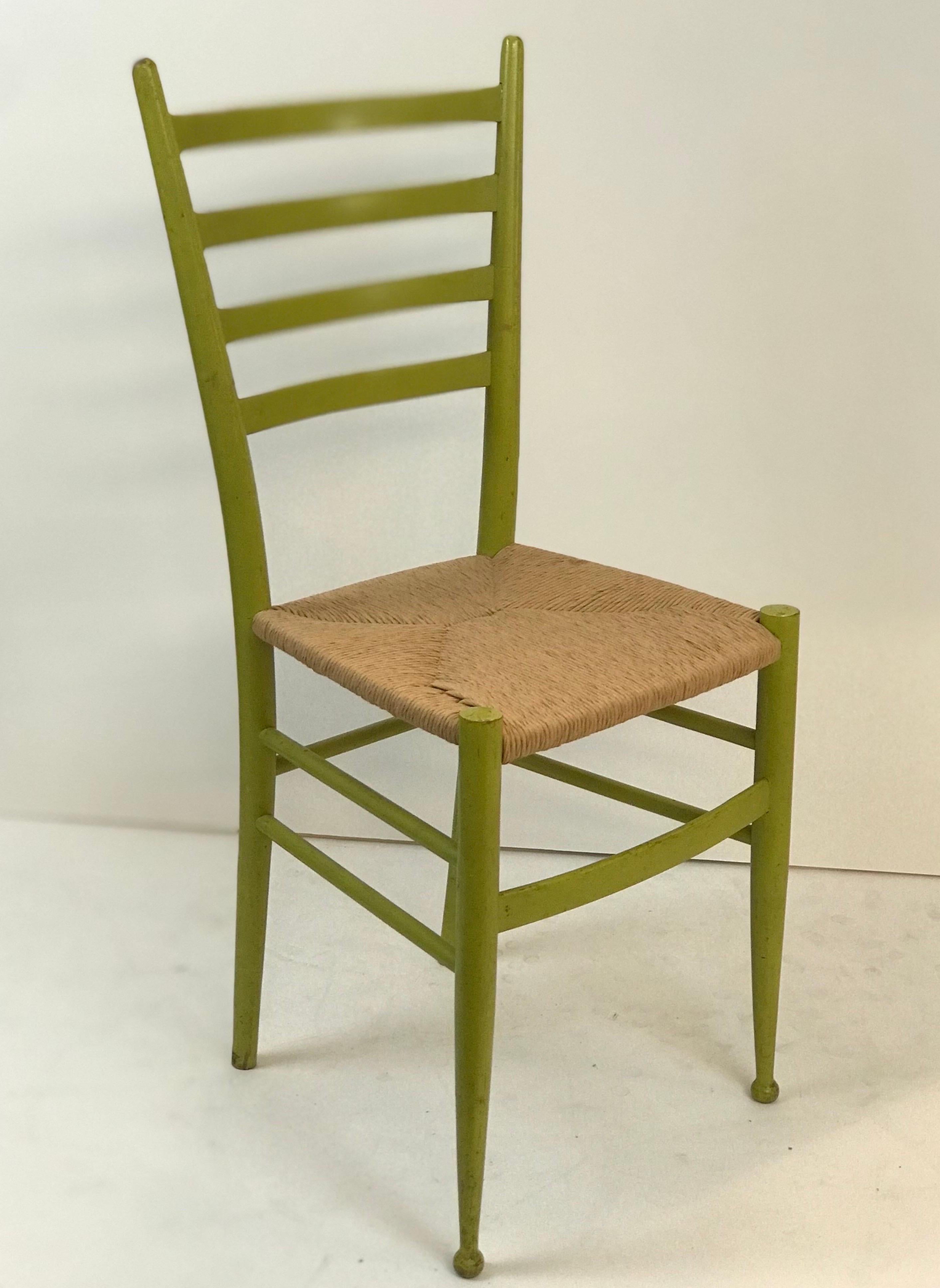 A traditional Spinetto, Italian ladder back chair made by Chiavari with new hemp rope woven seat in of the period green finish. Recently restored and in excellent structural and cosmetic condition. Wood shows signs of age and use but has no serious