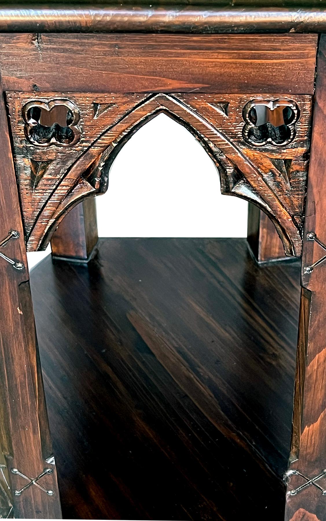 the octagonal top above a conforming openwork body with pierced trefoil ornamentation; the whole raised on six supporting columns all joined at the base by a lower shelf