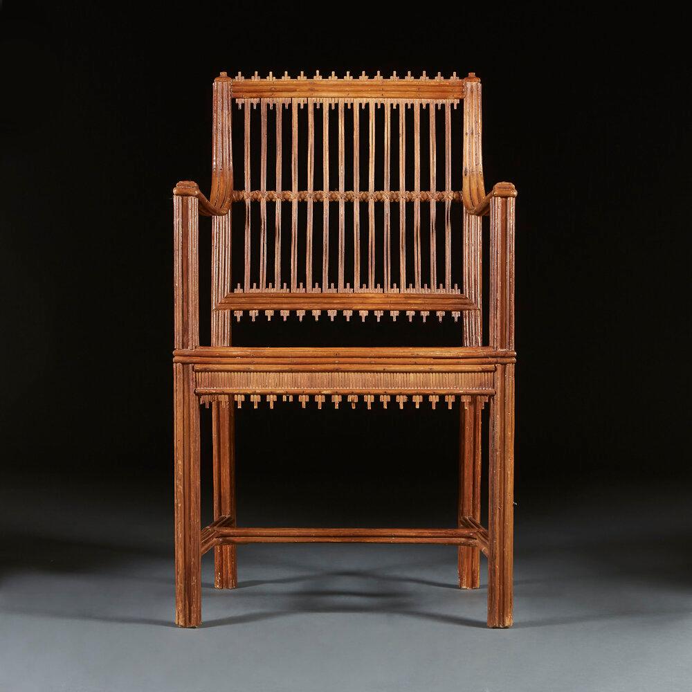 A mid nineteenth century rustic straw work armchair, with cross weaving to the seat and back splat and reeded decoration throughout, with curved arms and icicles to the back and the seat apron.