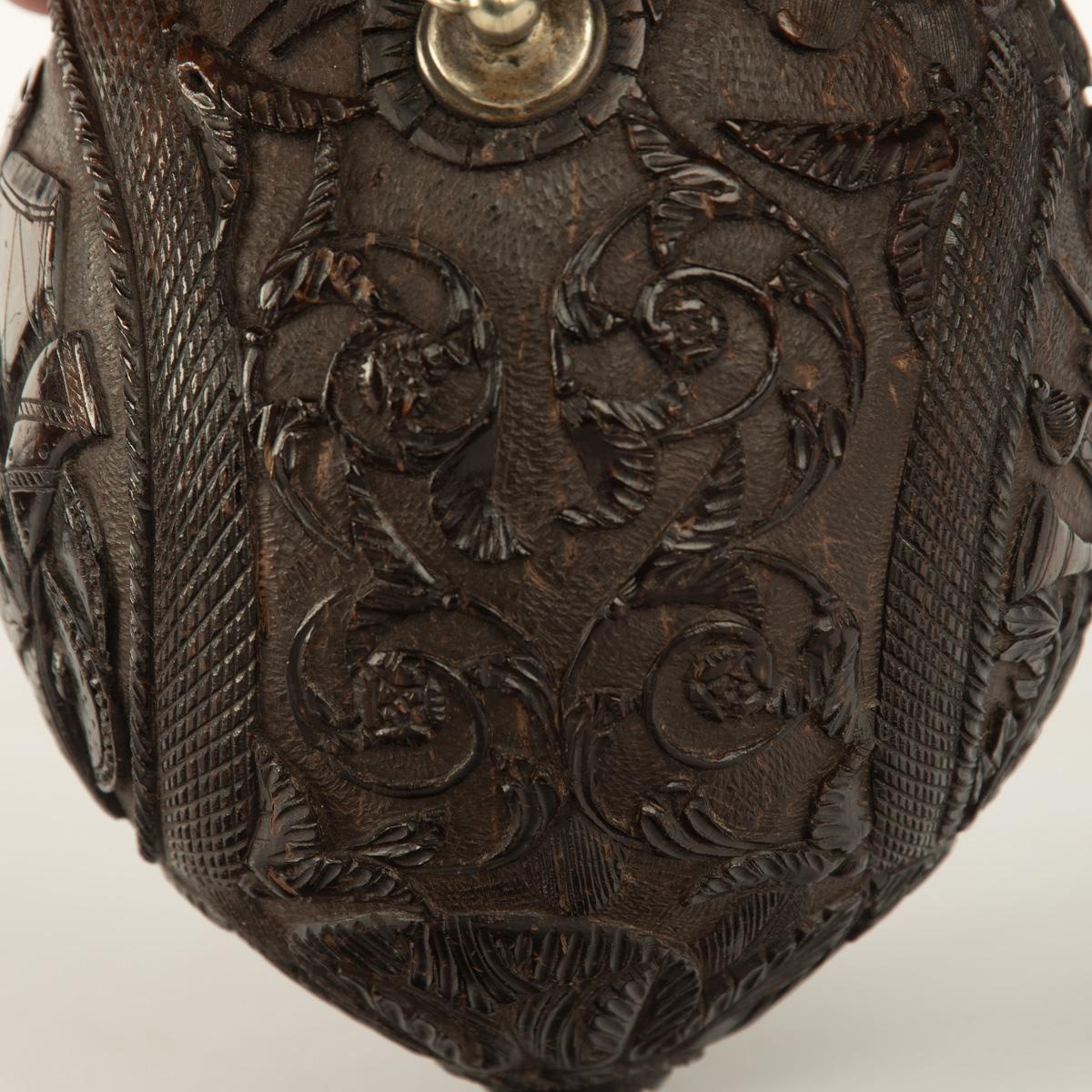 Coconut A sailor’s carved coconut Bugbear powder flask For Sale
