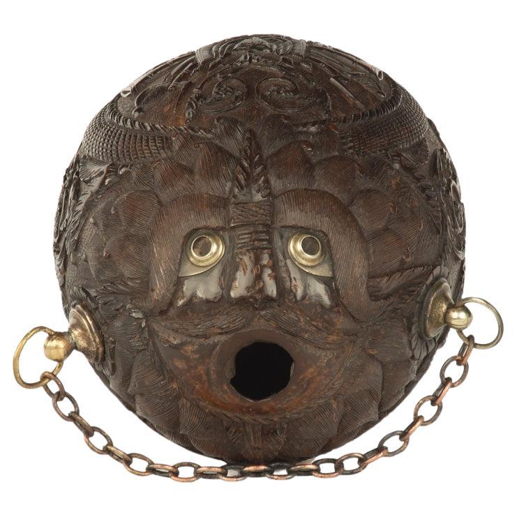 A sailor’s carved coconut Bugbear powder flask For Sale