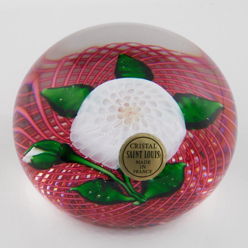 A Saint Louis Pom-Pom and Bud Reticello Paperweight, 1983

Additional information:
Date : 1983
Origin : France
Features : A fabulous millefiori Pom-Pom with bud and leaves 
Marks :  An SL 1983 signature cane to the base plus label and box
Type :