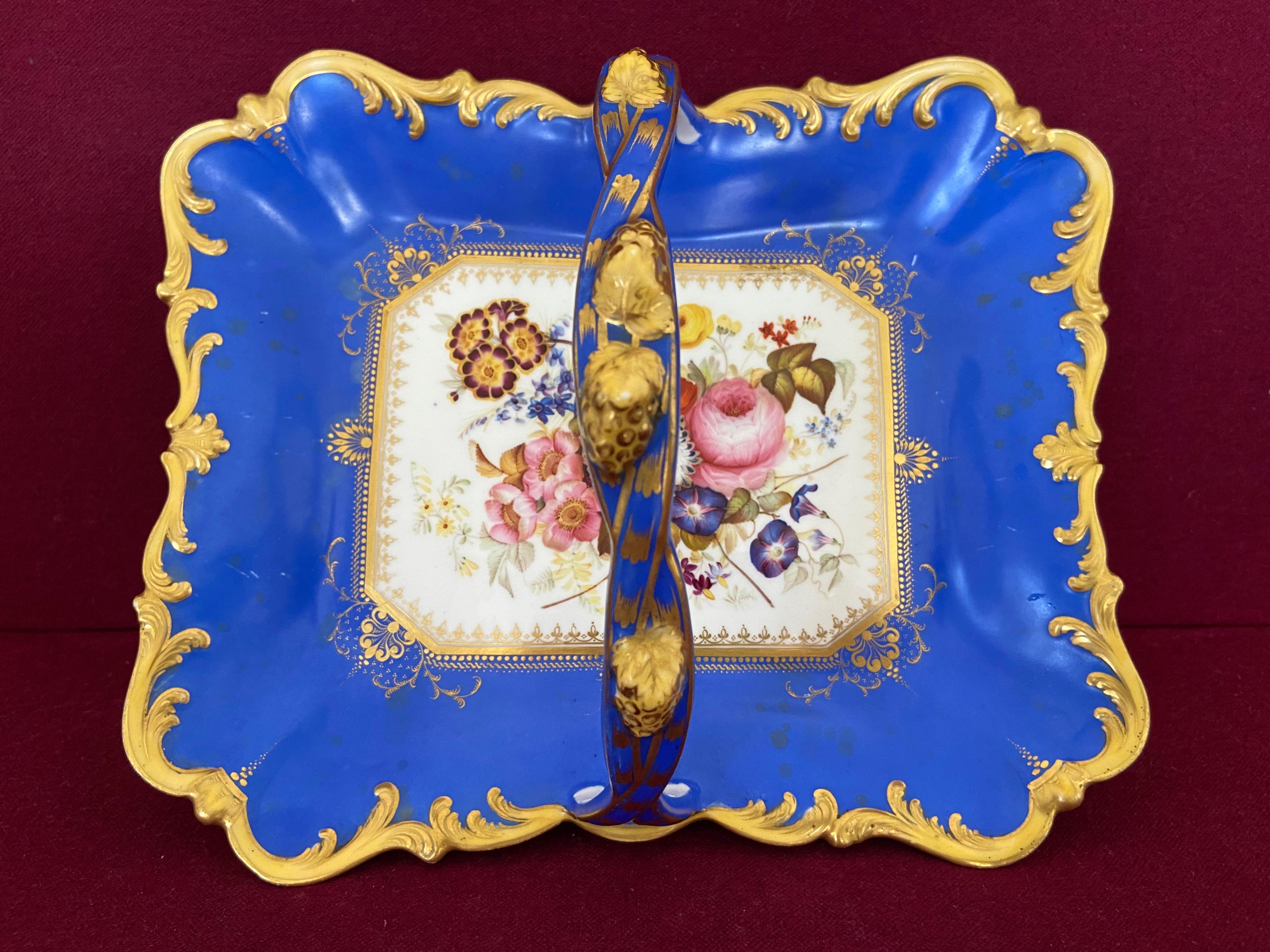 A fine Samuel Alcock porcelain fruit basket c.1830-1840. Finely decorated with painted Summer flowers. 

Condition: A few areas of staining to the blue ground.