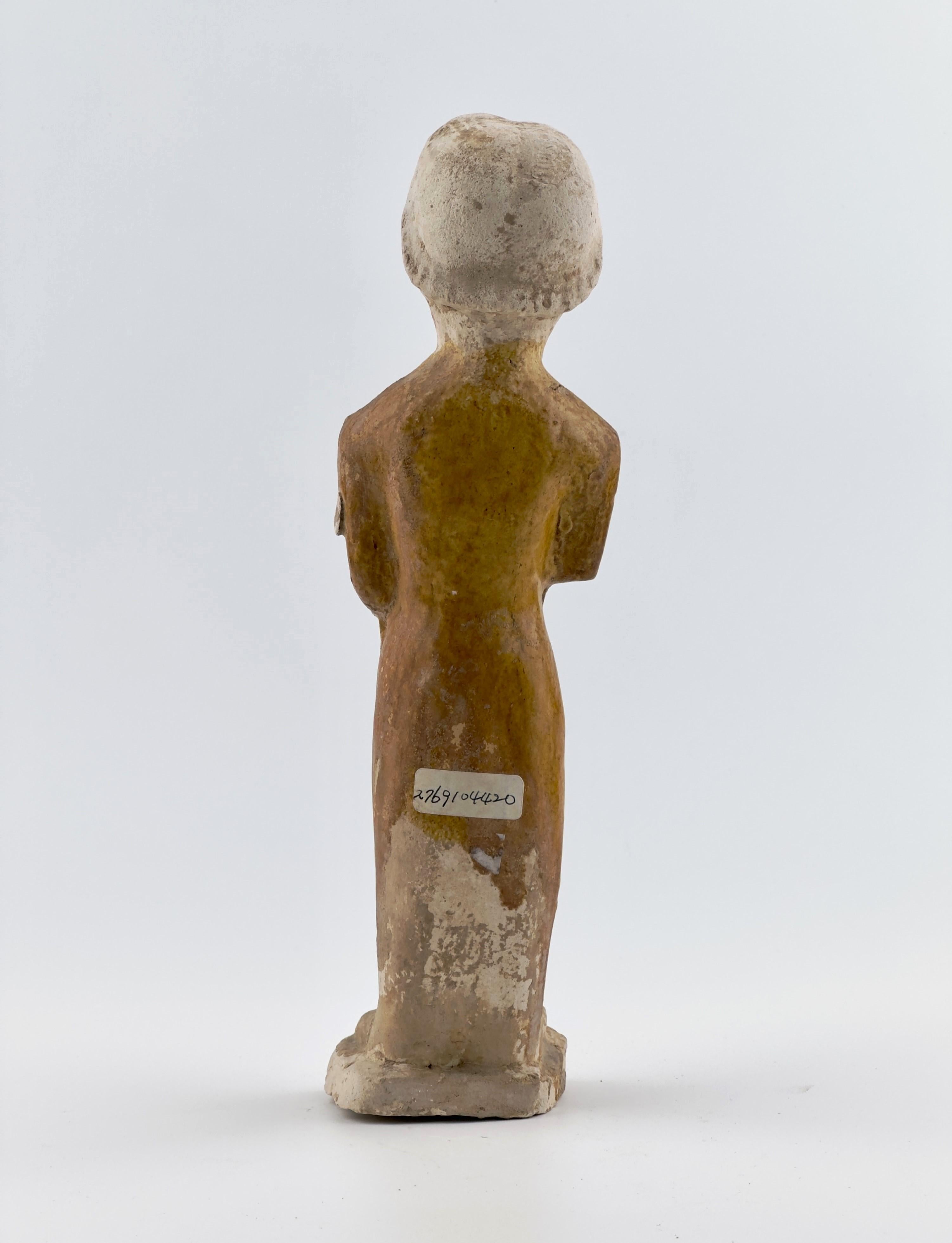 18th Century and Earlier A Sancai-Glazed Pottery Figure of Guardian Mingqi, Tang Dynasty(7-8th century)