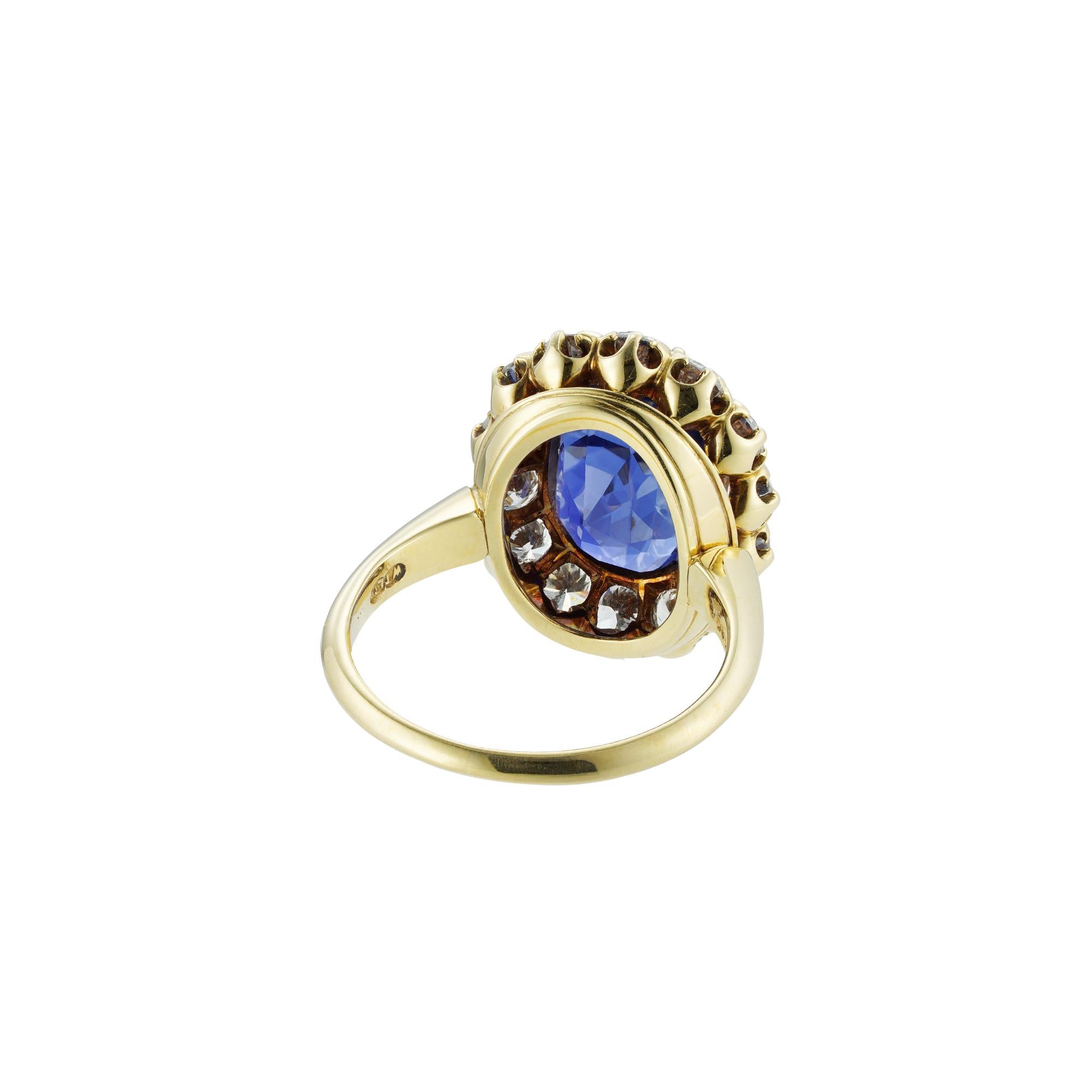 Oval Cut Sapphire and Diamond Cluster Ring For Sale