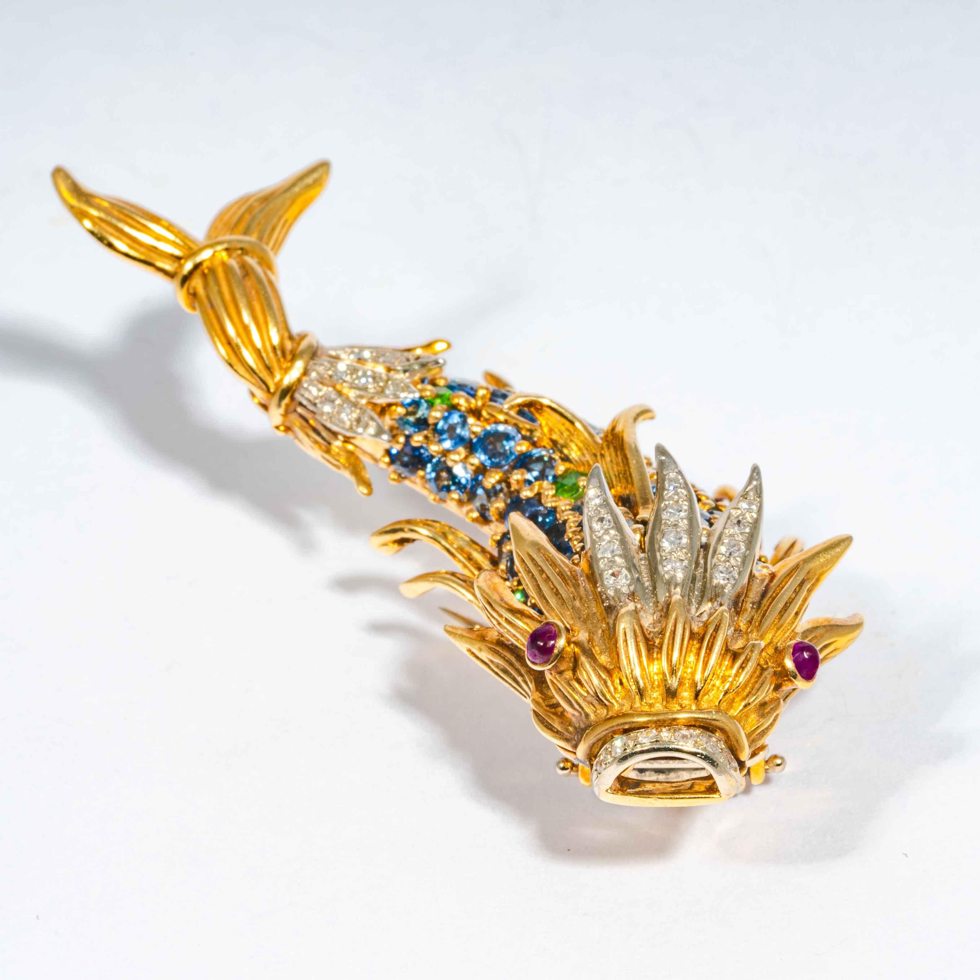 This mid-late 20th century pin is comprised of full cut blue Ceylon sapphires, and accenting gemset white diamonds fish 