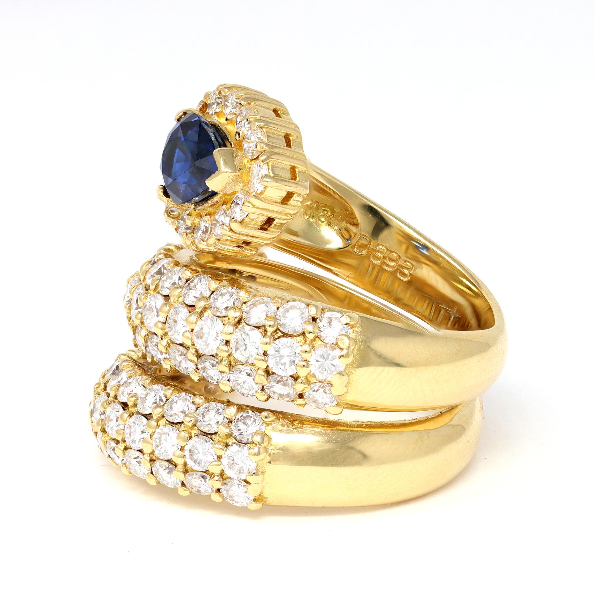 A ravishing cocktail ring designed as a snake featuring a vivid blue sapphire and pavé set diamonds. The sapphire is 1.48 carats and the diamonds are 3.93 carats. Both weights are stamped onto the ring as S-1.48 and D-3.93. The diamonds are GH color