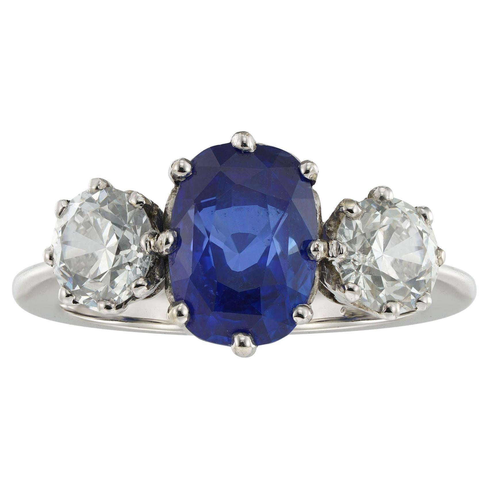 A sapphire and diamond three stone ring