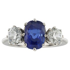 A sapphire and diamond three stone ring