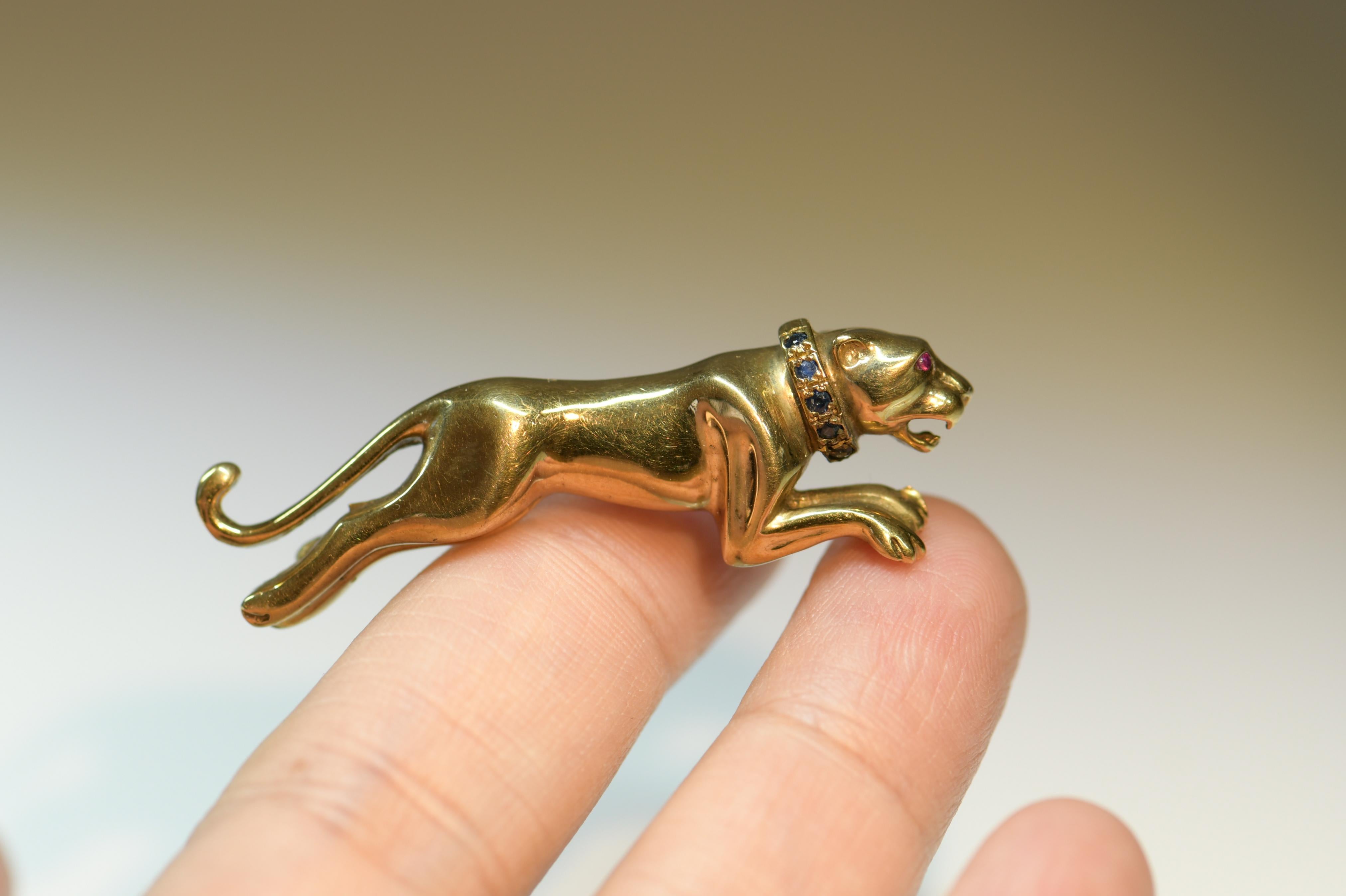 Round Cut Sapphire and Ruby Running Panther Gold Brooch, circa 1980s