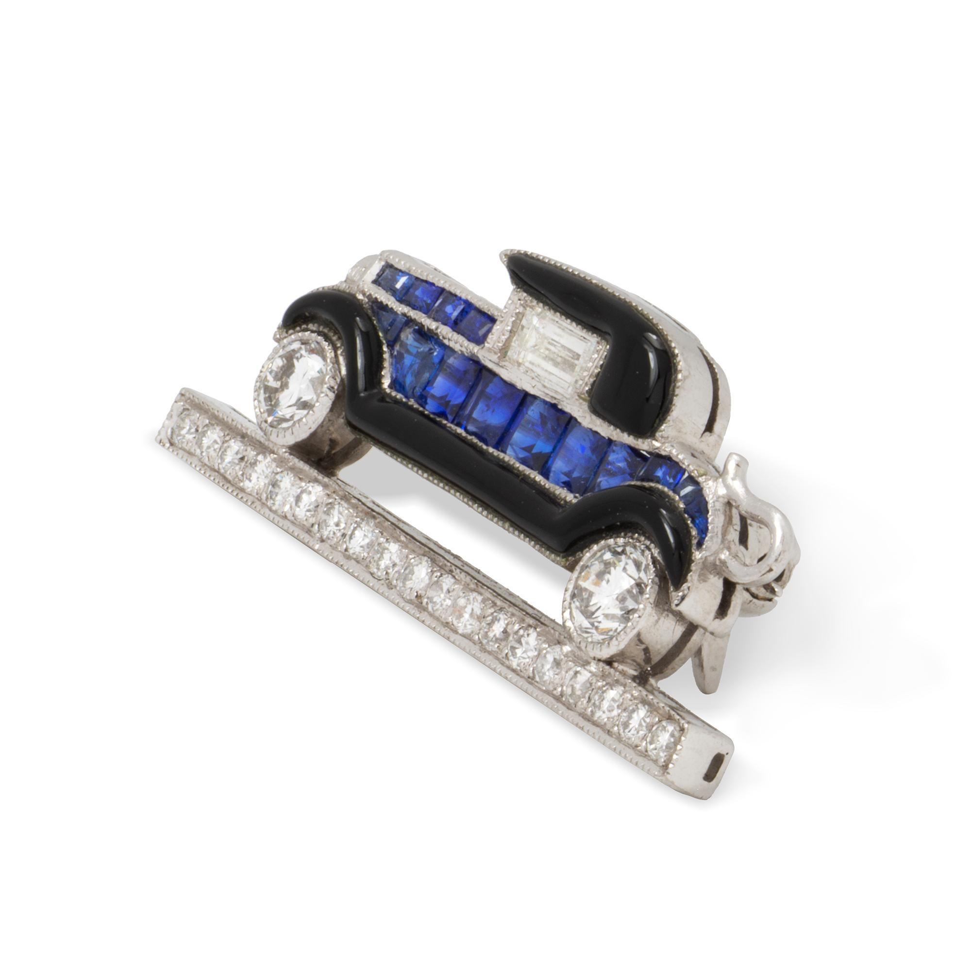 A sapphire, diamond and enamel car brooch, the 1930's style car with round brilliant-cut diamond wheels, baguette-cut diamond window, calibré-cut sapphire body and bonnett, with black enamel hood and running board, parked on a row of nineteen round