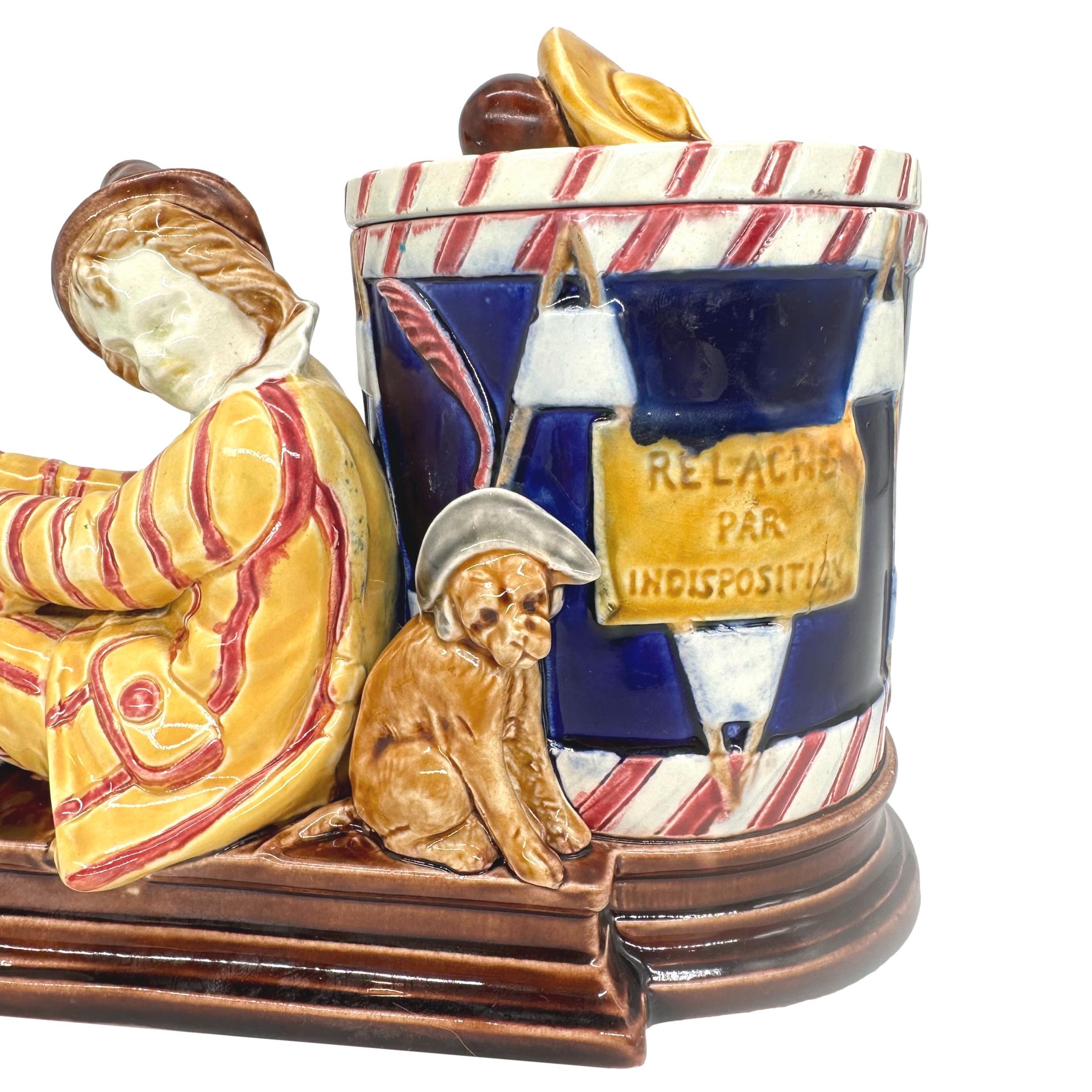 A Sarreguemines Majolica Smoking Stand, Drunk Street Musician and Dog, ca. 1880 In Good Condition For Sale In Banner Elk, NC