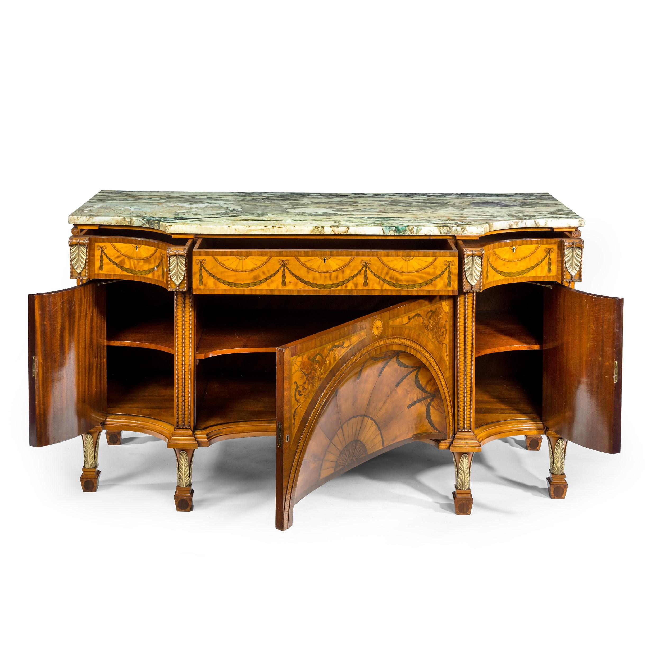 An Exceptional Edwardian Satinwood Commode, Reproducing Thomas Chippendale’s Piece-Known as the Diana and Minerva Commode-Supplied to the Lascelles Family at Harewood House

A satinwood Sheraton Revival breakfront marquetry commode, the shaped