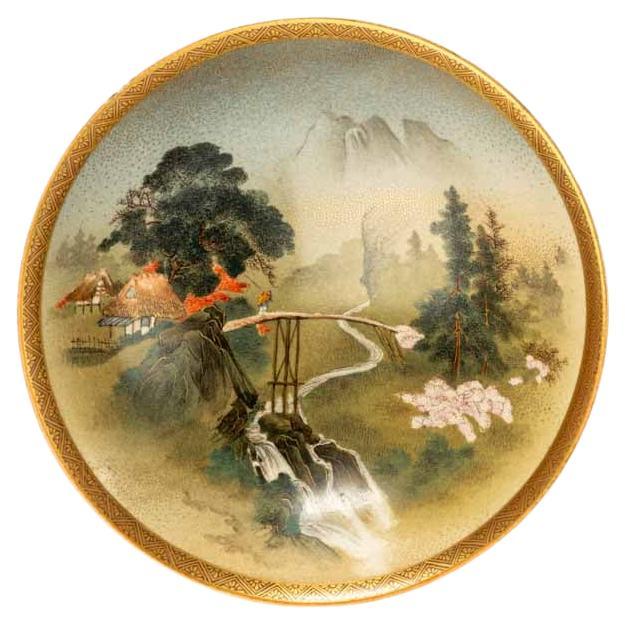 A Satsuma bowl decorated with a striking landscape