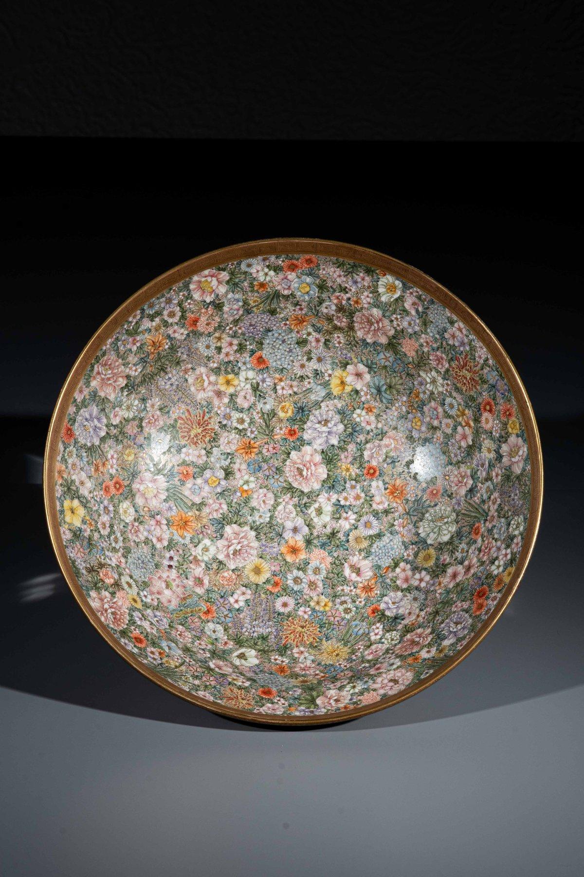 Large Satsuma ceramic bowl decorated with an elegant millefiori motif that combines chrysanthemums, wisteria, peonies, irises, azaleas and hydrangeas.

On the outer rim, the floral motif continues with rich detail and a three-dimensional effect