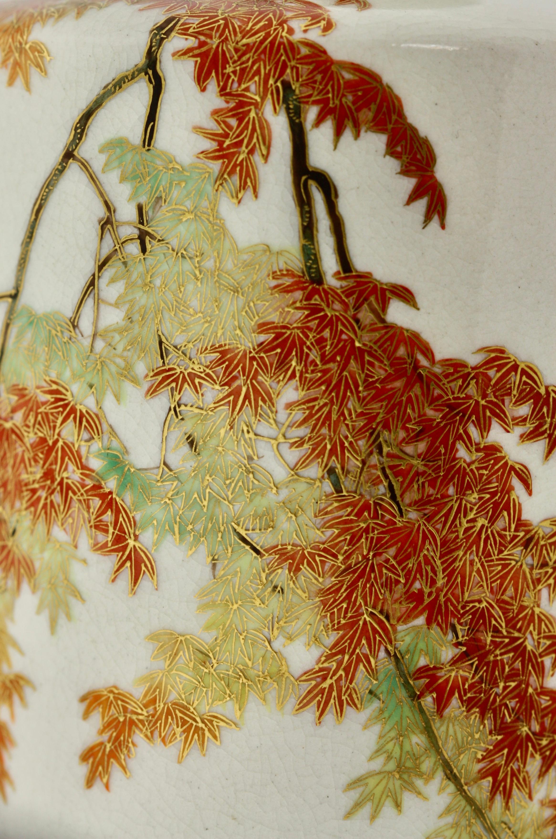 A Satsuma tapering cylindrical square high-shouldered vase
by Yabu Meizan,
Osaka, 1853-1934,
decorated in polychrome enamels and gilt over a clear, crackled glaze delicately painted with maples, signed in gilt YABU MEIZAN,
Measures: 6.5 in.