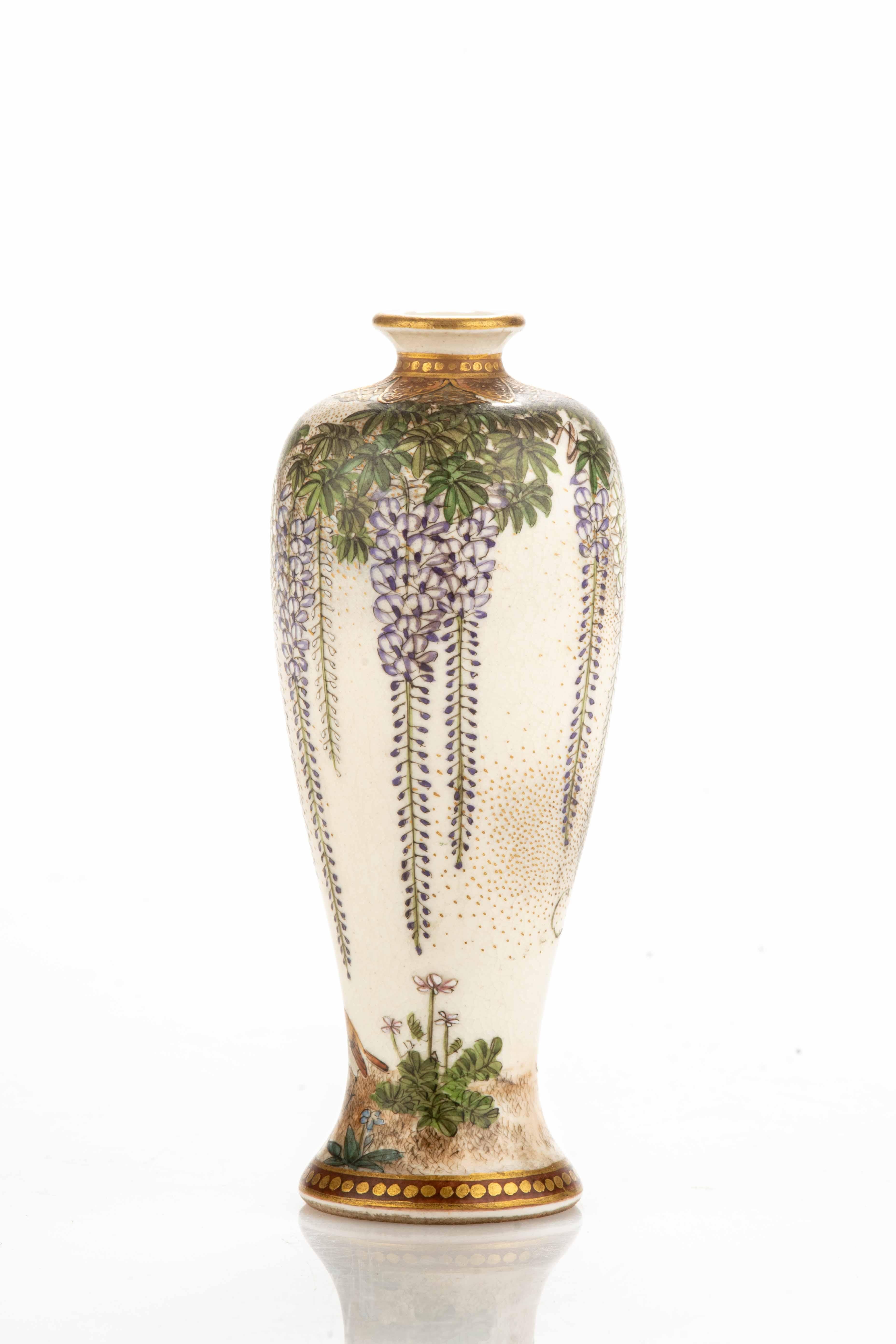 A satsuma ceramic vase decorated with a delicate pattern of leaves and wisteria. At the base, an enchanting scene portrays a pair of canaries with bright colors and accurate details.

Signed Kinkozan under the base.

Period: Meiji mid-19th