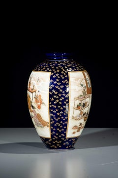 A Satsuma vase with courtly scenes on a cobalt-blue ground
