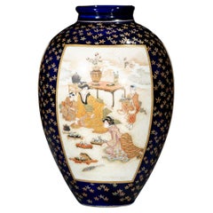A Satsuma vase with courtly scenes on a cobalt-blue ground