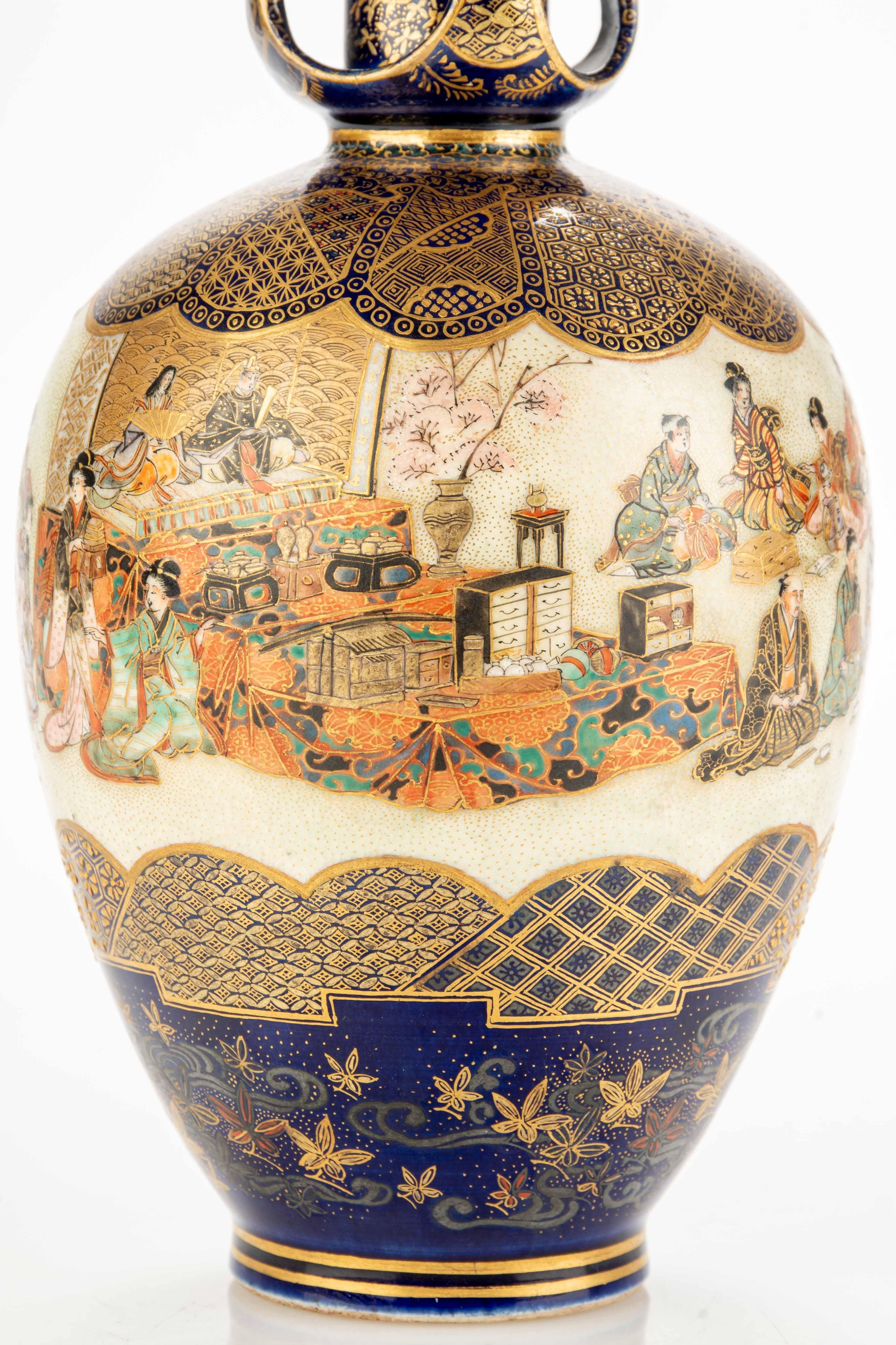 Ceramic A Satsuma vase with numerous figures bringing gift