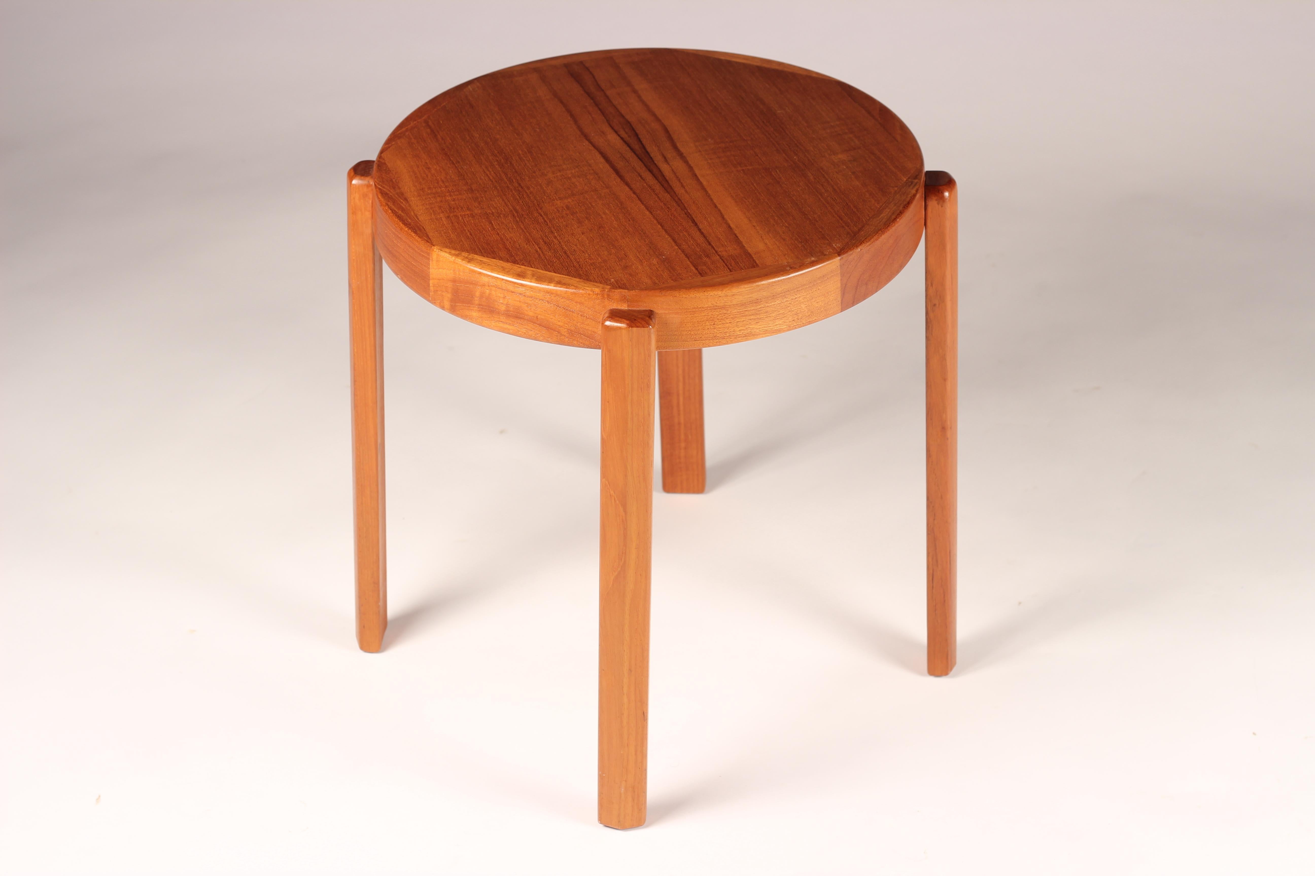 A simple paired back Danish designed Teak Mid-Century Modern Table. Professionally polished and in good condition. With fine and interesting grain pattern and simple detailing, this table dismounts for easy shipping or storage.