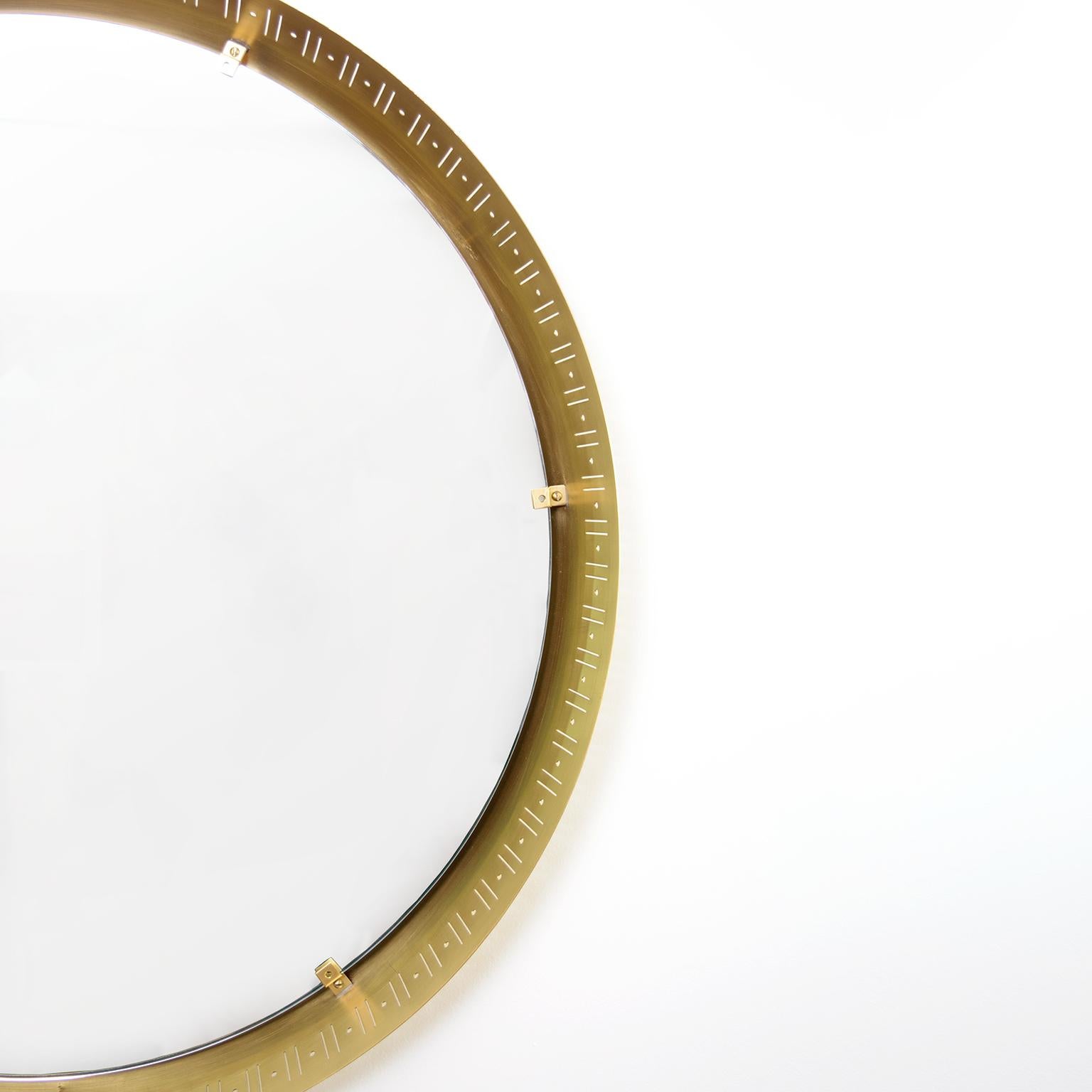 Scandinavian Modern, Round Polished Brass Mirror with Cutouts In Good Condition For Sale In New York, NY