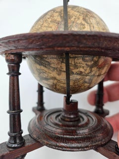 A scarce and beautiful miniature celestial globe produced in Amsterdam.