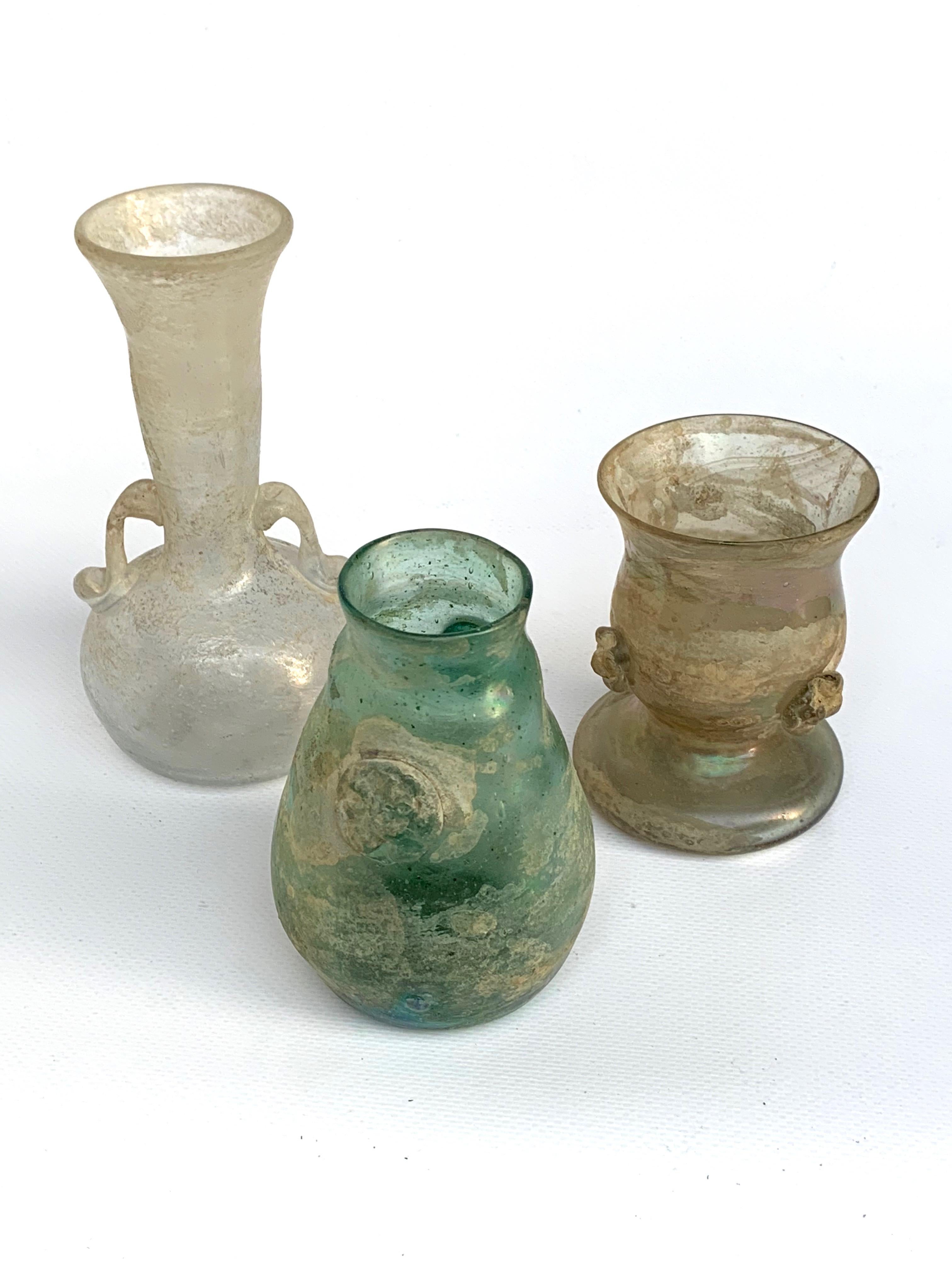Collection of three colored glass vases of one 
