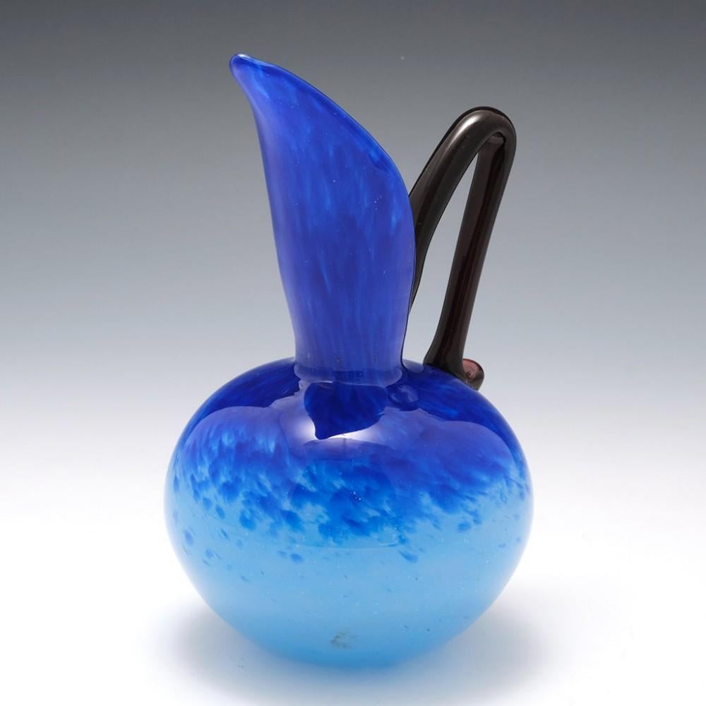 A Schneider Blue Glass Pitcher, circa 1925

Additional information:
Date : circa 1920-1930
Origin : Epinay-sur-Seine, France
Colour : Lustrous powder and deep blue. The glossy finish would indicate that this was probably made between 1924 and