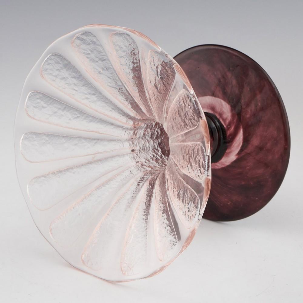 A Schneider Coupe Bijoux made from 1927-29 in Epinay-sur-Seine, Paris, France.
The bowl features fan shaped frosted panels in clear glass transitioning to an abbreviated amethyst knopped stem. Acid etched SCHNEIDER on the foot

Condition :