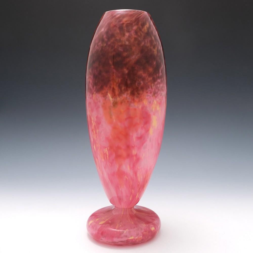 An intercalary decorated Schneider glass vase from 1925-1930 made in Epinay-sur-Seine, Paris, France. Flocculate wine, rose and plum with splashes of yellow. Baluster shaped. Acid etched signature in block capitals SCHNEIDER


Additional