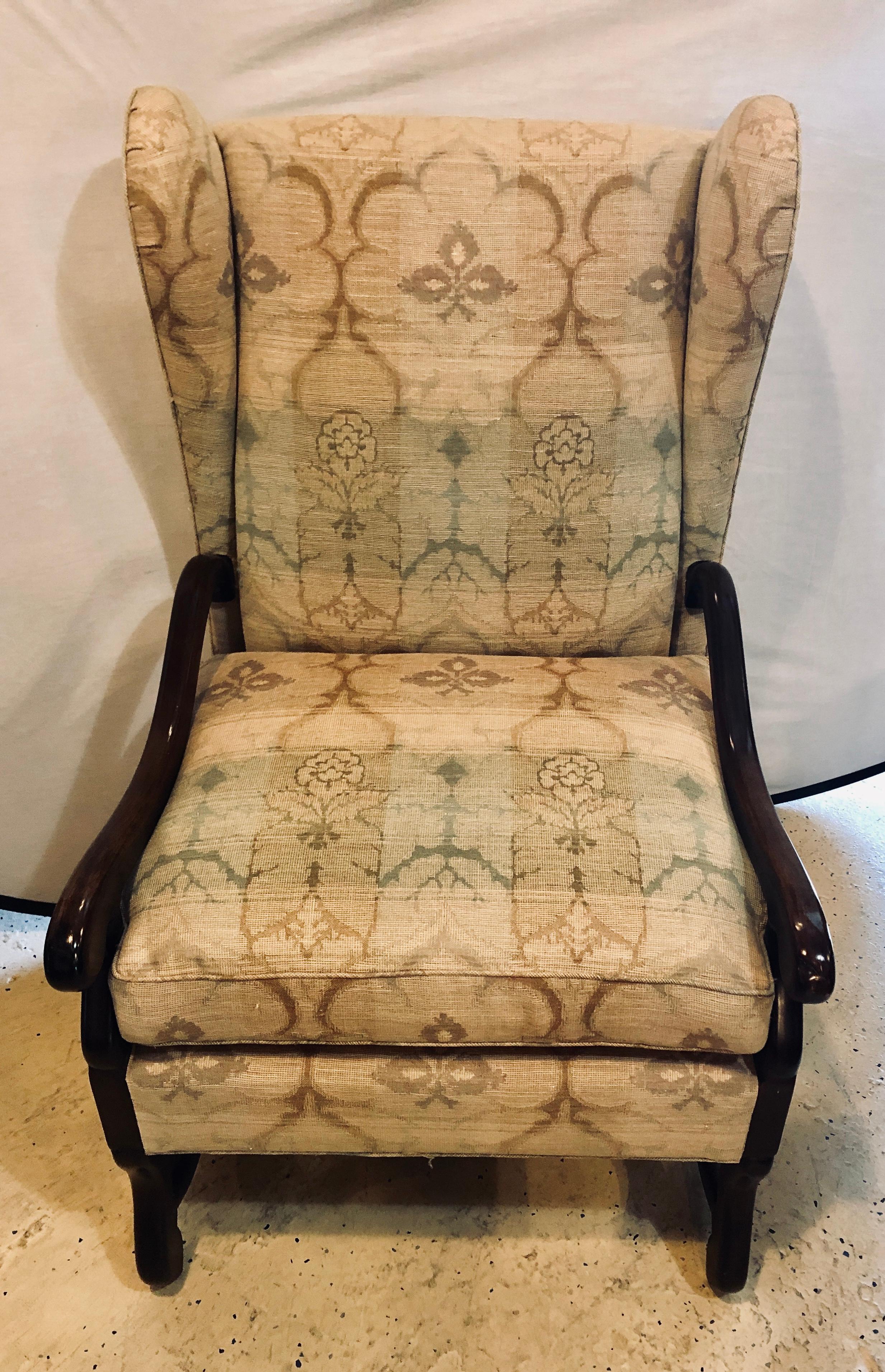 A. Schneller Sons Colonial wingback armchair in a very lovely fine fabric. The provenance of this firm is equally as impressive as its top-of-the line, custom-built, all hand-done upholstery and draperies. Today, A. Schneller Sons is led by