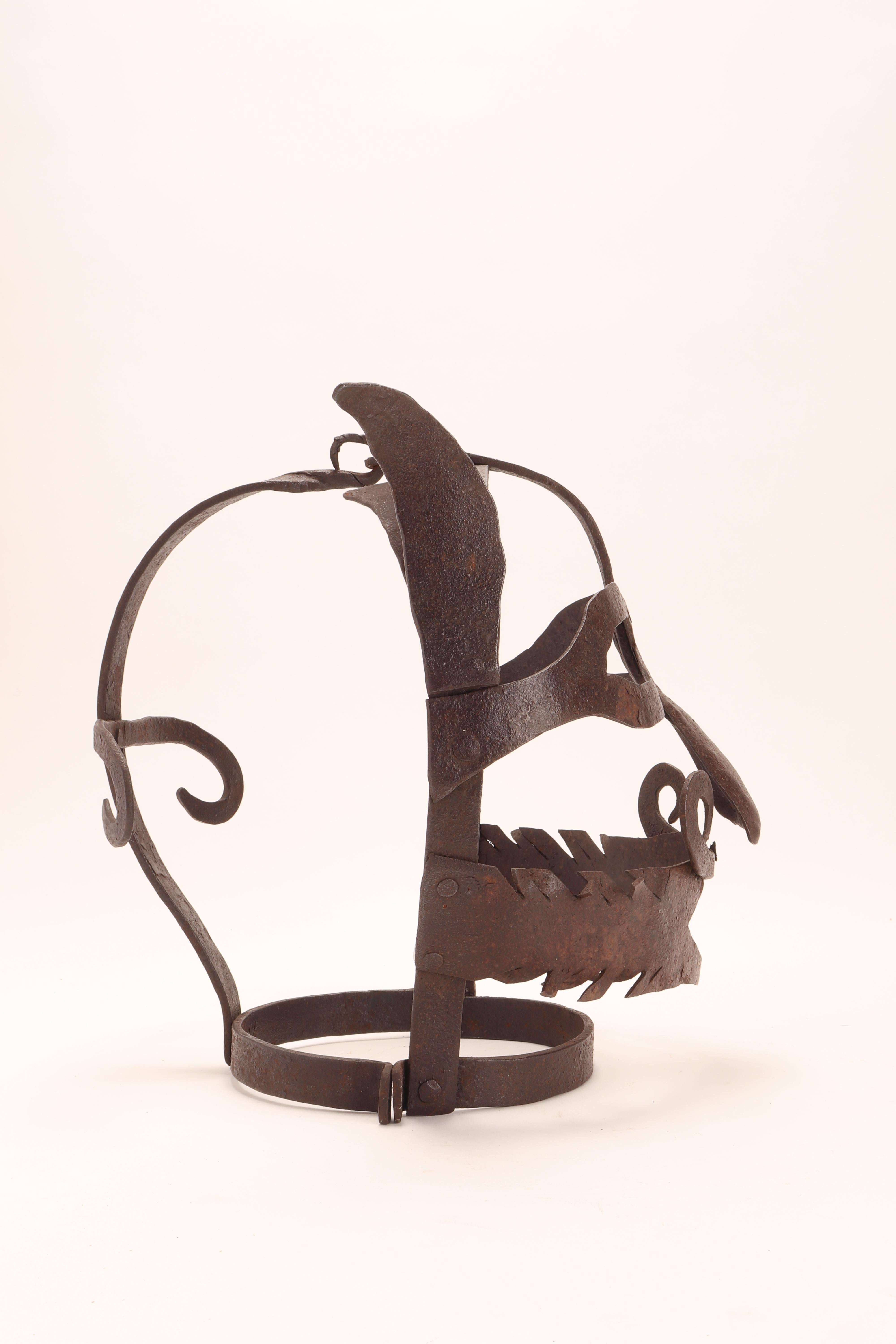 Scold’s bridle, a metal mask, was used to punish mainly women found gossiping, nagging, brawling with neighbors or lying. The torture device is an iron muzzle in an iron framework that enclosed the head. United Kingdom, early 1700.