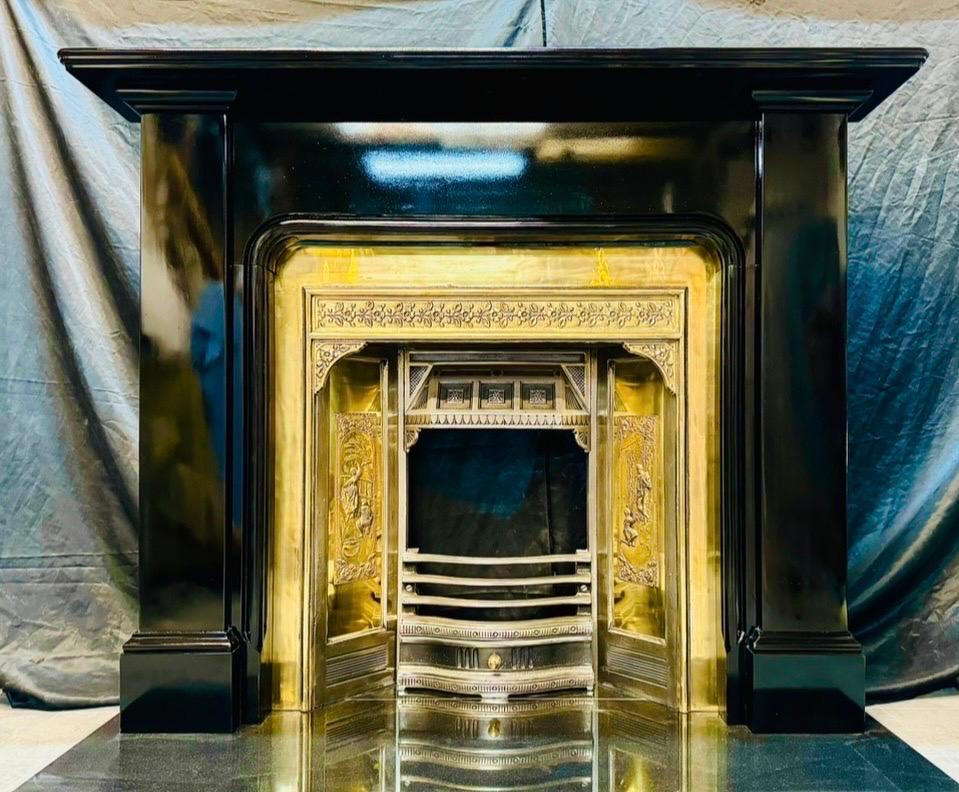 A classic antique 19th Century Scottish Ballachulish slate fireplace surround of elegant proportions.
A moulded top shelf rests above a shaped frieze that incorporates a staff bead detail along the bottom edge. This in turn is flanked by a pair of