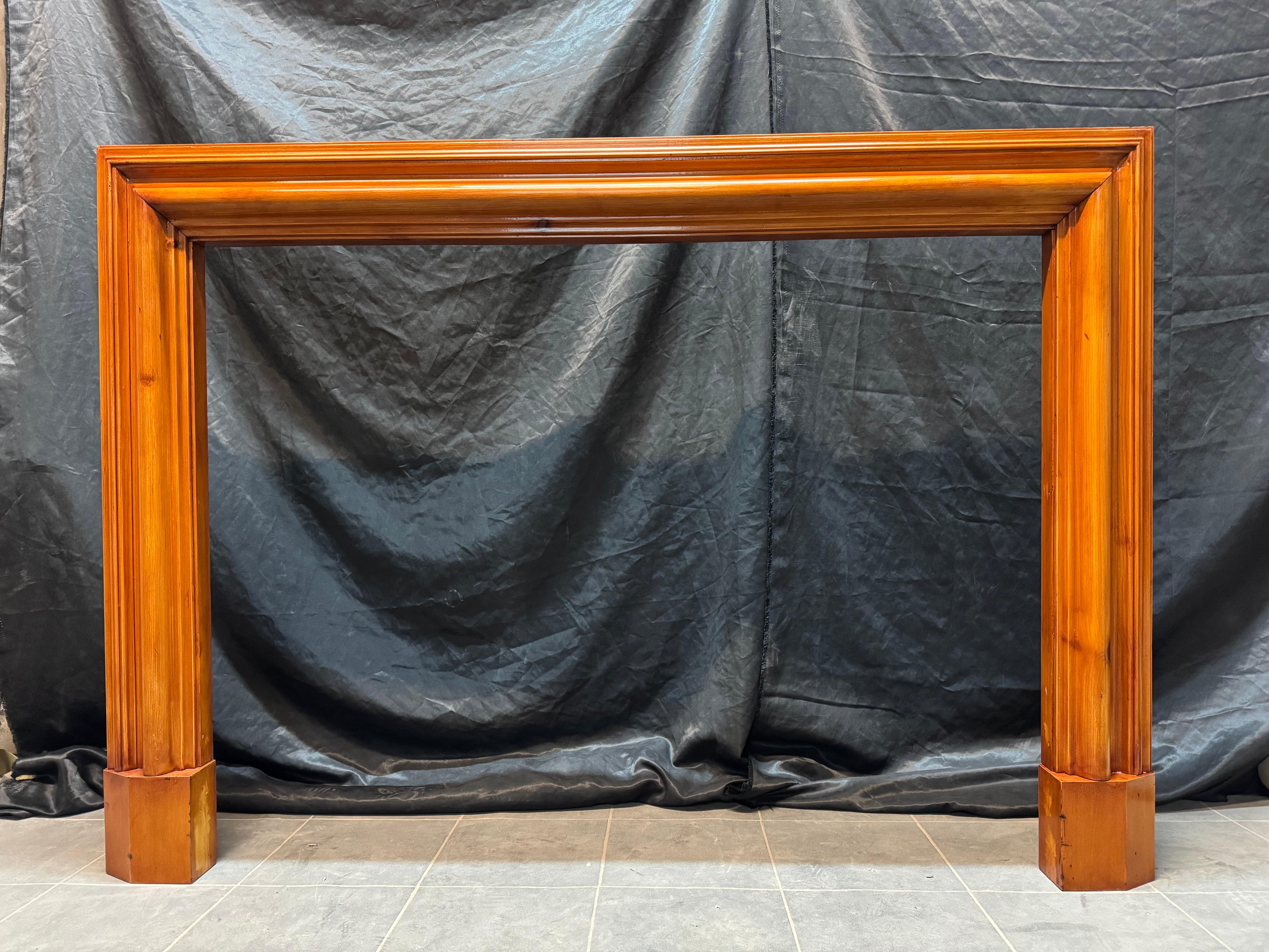 A Scottish Edwardian Scots Pine Bolection Fireplace Surround. 
A deep moulded bolection front frame, with generous return sections to wall, all resting on splayed foot blocks. The Scot’s pine has taken on a deep honey colour over the years, this has