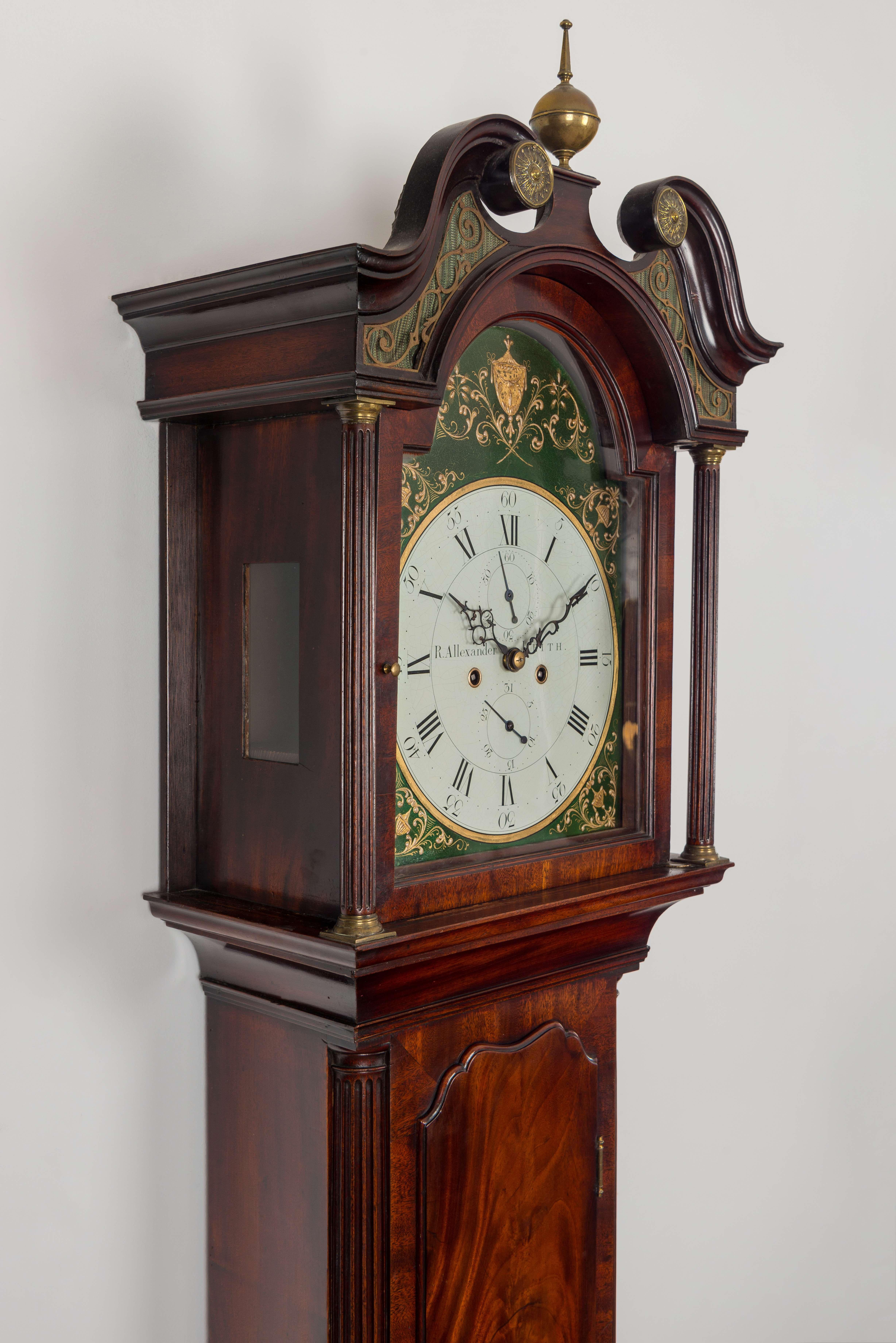 A superb antique mahogany Scottish longcase clock of classically elegant and restrained proportions, so typical of the best Edinburgh makers. The arched, signed painted dial has central seconds and date indication within a gilt border, the corners